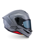 Alpinestars S-R7 Solid hjelm, full-face motorcykelhjelm, blank grå, sideprofil, blank grå aerodynamisk skal med sort logo og røde detaljer ved bunden, højtydende racing- og sportskørselsudstyr