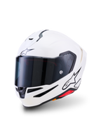 Alpinestars S-R7 Solid hjelm, full-face motorcykelhjelm, blank hvid, mørkt tonet visir, sort stjerne-logo på panden og siden, aerodynamisk skal med ventilationsåbninger og røde detaljer, højtydende udstyr til racing og landevej