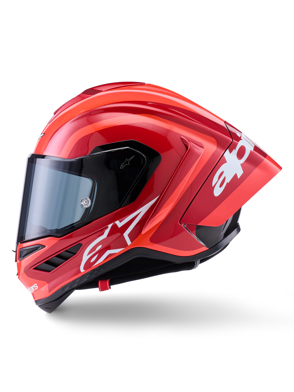 Alpinestars Supertech R10 Arius hjelm, full-face racerhjelm, blank rød med hvid logografik, sideprofil der fremhæver den aerodynamiske spoiler og det klare visir, carbon-kompositskal til professionel motorsport
