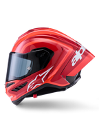 Alpinestars Supertech R10 Arius hjelm, full-face racerhjelm, blank rød med hvid logografik, sideprofil der fremhæver den aerodynamiske spoiler og det klare visir, carbon-kompositskal til professionel motorsport