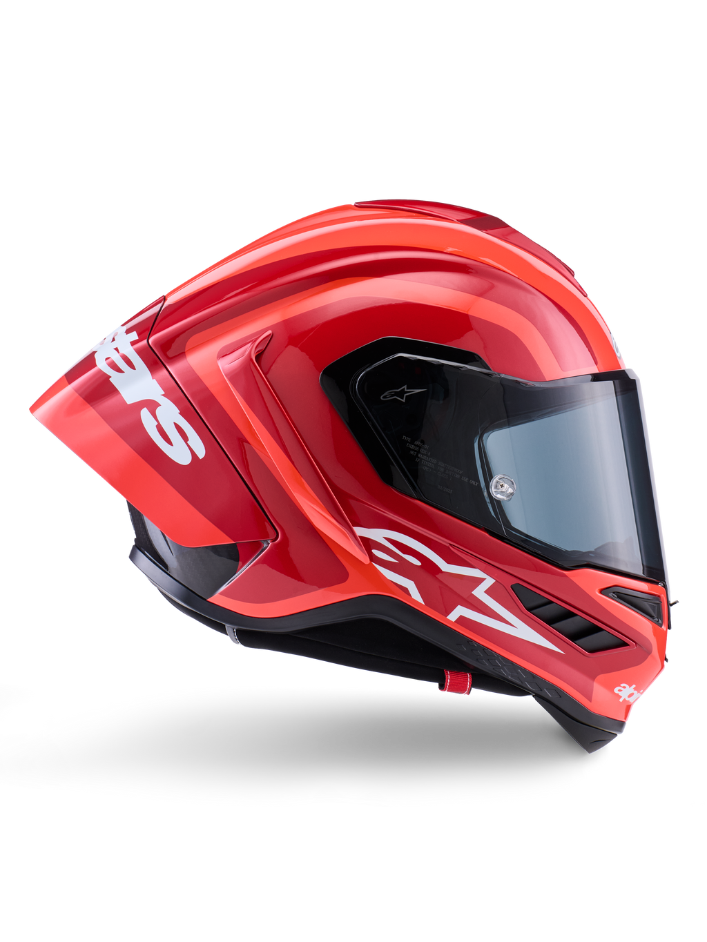 Alpinestars Supertech R10 Arius-hjelm, full-face racerhjelm, blank rød og orange, sideprofil med en aerodynamisk bagspoiler, hvidt Astars-logo på hagen og klart visir, konstrueret til højtydende kørsel på banen