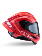 Alpinestars Supertech R10 Arius-hjelm, full-face racerhjelm, blank rød og orange, sideprofil med en aerodynamisk bagspoiler, hvidt Astars-logo på hagen og klart visir, konstrueret til højtydende kørsel på banen