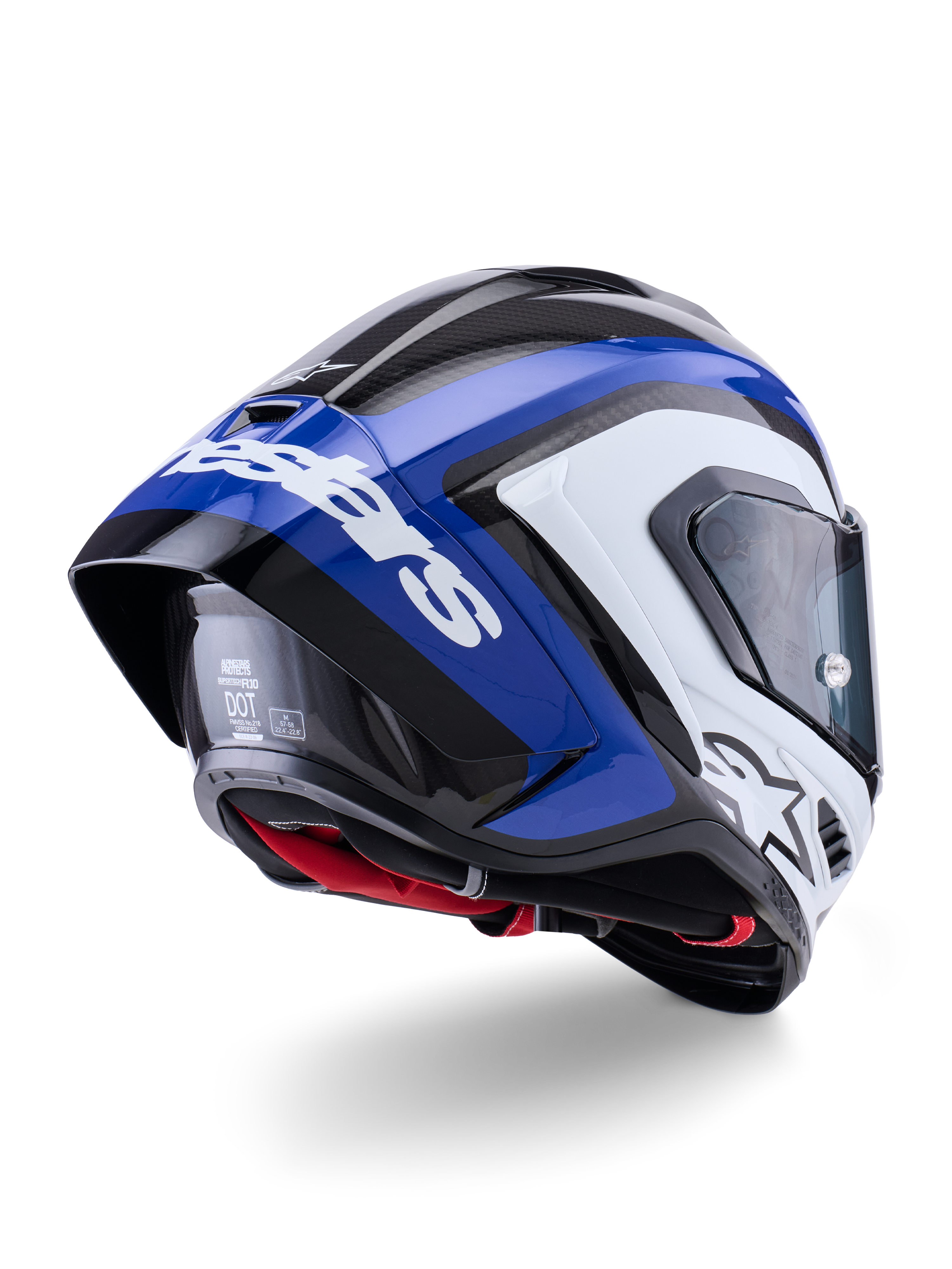 Alpinestars Supertech R10 Arius-hjelm, full-face racerhjelm, blank sort, hvid og blå, set bagfra i trekvart profil, der viser den aerodynamiske spoiler, synlig kulfiber-tekstur og fremtrædende hvid Alpinestars-branding