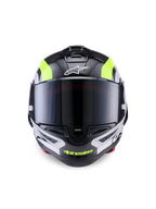 Alpinestars Supertech R10 Arius hjelm, racermotorcykelhjelm, sort, sølv og gul fluo blank, set forfra med kulfiberskal, mørkt røgfarvet visir og integreret ventilationssystem.
