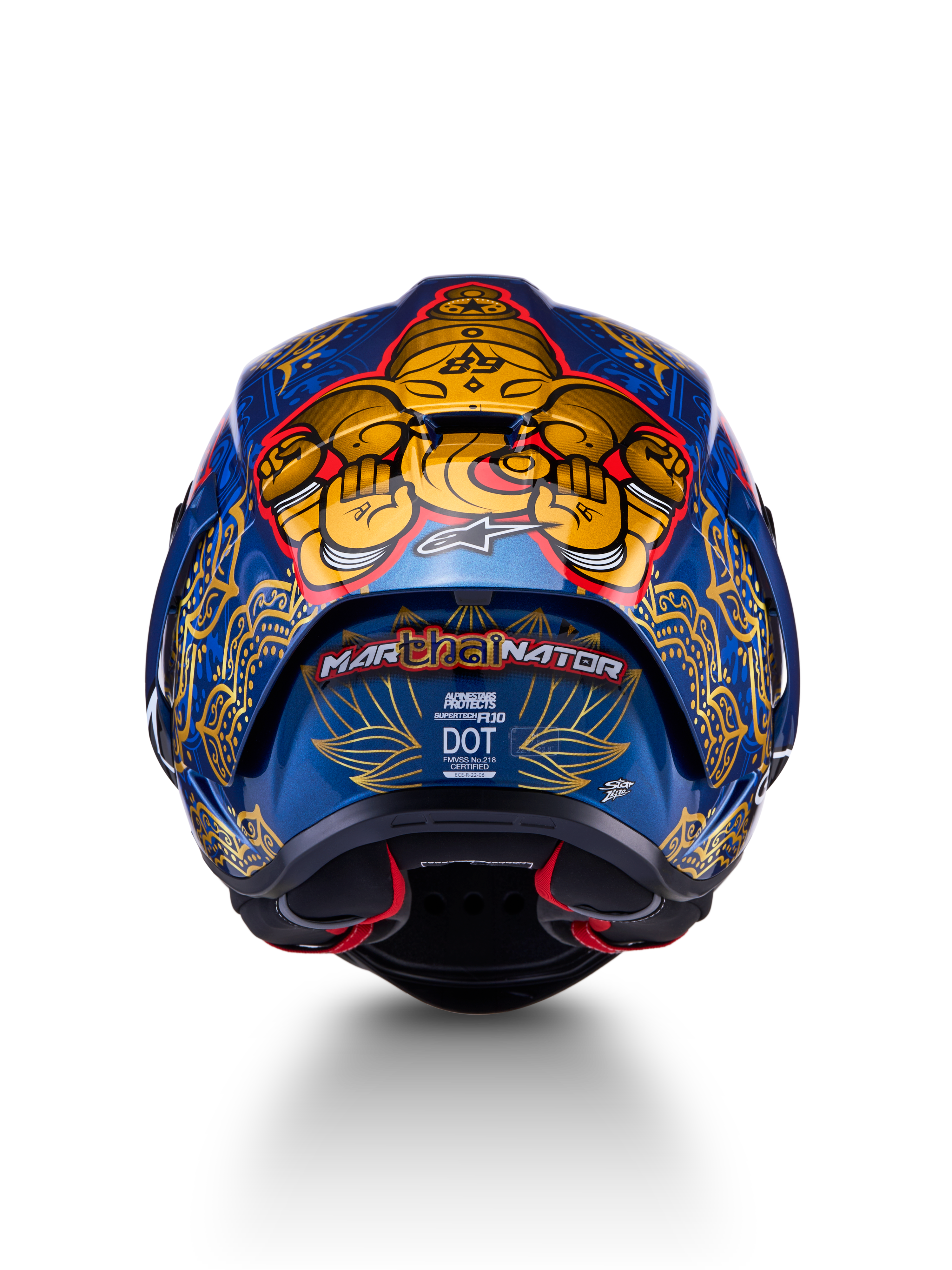 Supertech R10 Martinator Thai-hjelm set bagfra, blank blå kulfiberskal med detaljeret guld-grafik.