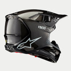 Alpinestars Supertech M10 Solid hjelm, motocross-hjelm, sort blank carbon-finish, med hvidt Astars-logo og S-M10-branding, aerodynamisk skal med synlig carbon-vævning og flere ventilationsporte