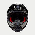 Alpinestars Supertech M10 Solid hjelm, motocrosshjelm, sort blank kulfiber, set forfra med rødt indvendigt for, kulfiberskal og "ONE GOAL. ONE VISION." slogan på visiret