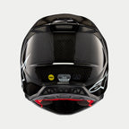Alpinestars Supertech M10 Solid hjelm, sort blank kulfiber, set bagfra viser blank kulfibervævning, hvidt Alpinestars-logo, MIPS- og ECE-certificeringsmærkater, aerodynamisk form med ventilationsåbninger
