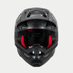Alpinestars Supertech M10 Fame ECE 22.06 hjelm, motocrosshjelm, mat og blank sort carbon, set forfra med synlig rød indvendig polstring, aerodynamisk kulfiberskal, ventileret design til off-road racing