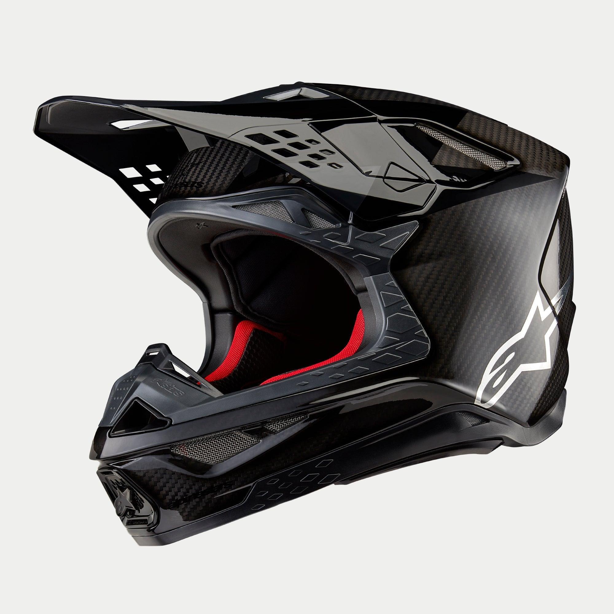 Alpinestars Supertech M10 Fame ECE 22.06 hjelm, motocrosshjelm, sort carbon i mat og blank finish, med synlig kulfibervævning, hvidt Astar-logo på siden og rød indvendig polstring, aerodynamisk off-road design