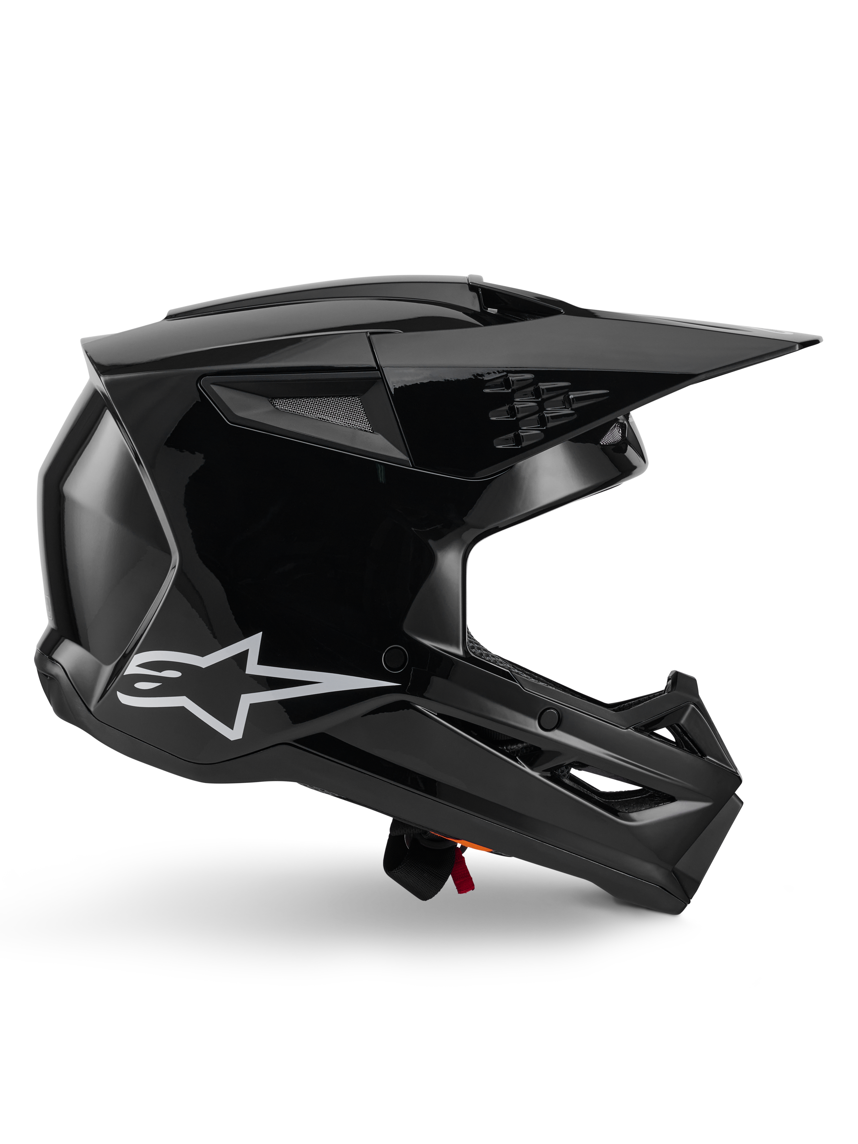 Alpinestars S-M3 Solid hjelm, motocrosshjelm, blank sort, sideprofil med hvidt stjerne-logo, kantet aerodynamisk design med mesh-ventilation og skærm, beskyttende off-road racing-hovedbeklædning