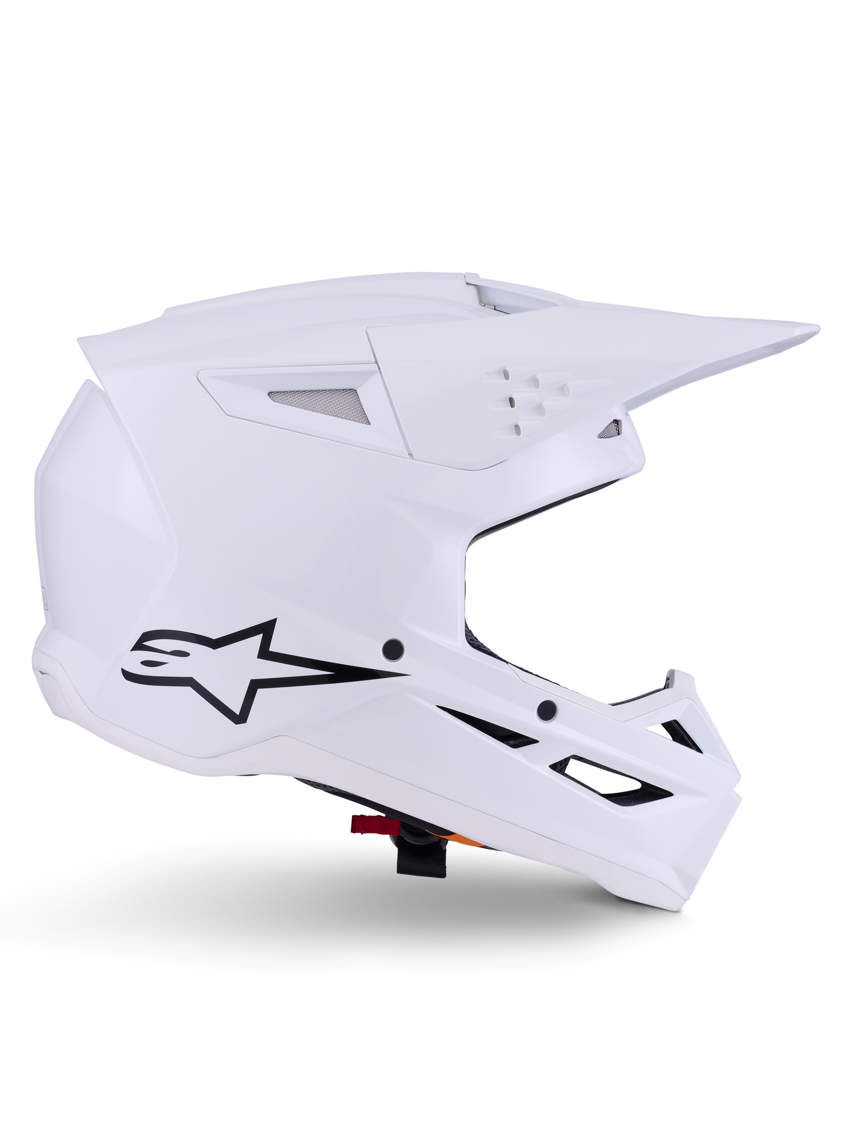 Alpinestars S-M3 Solid hjelm, motocross hjelm, blank hvid, sideprofil med sort stjernelogo, kantet aerodynamisk skal, flere ventilationsåbninger, integreret visir og hageværn, off-road racerbeskyttelse