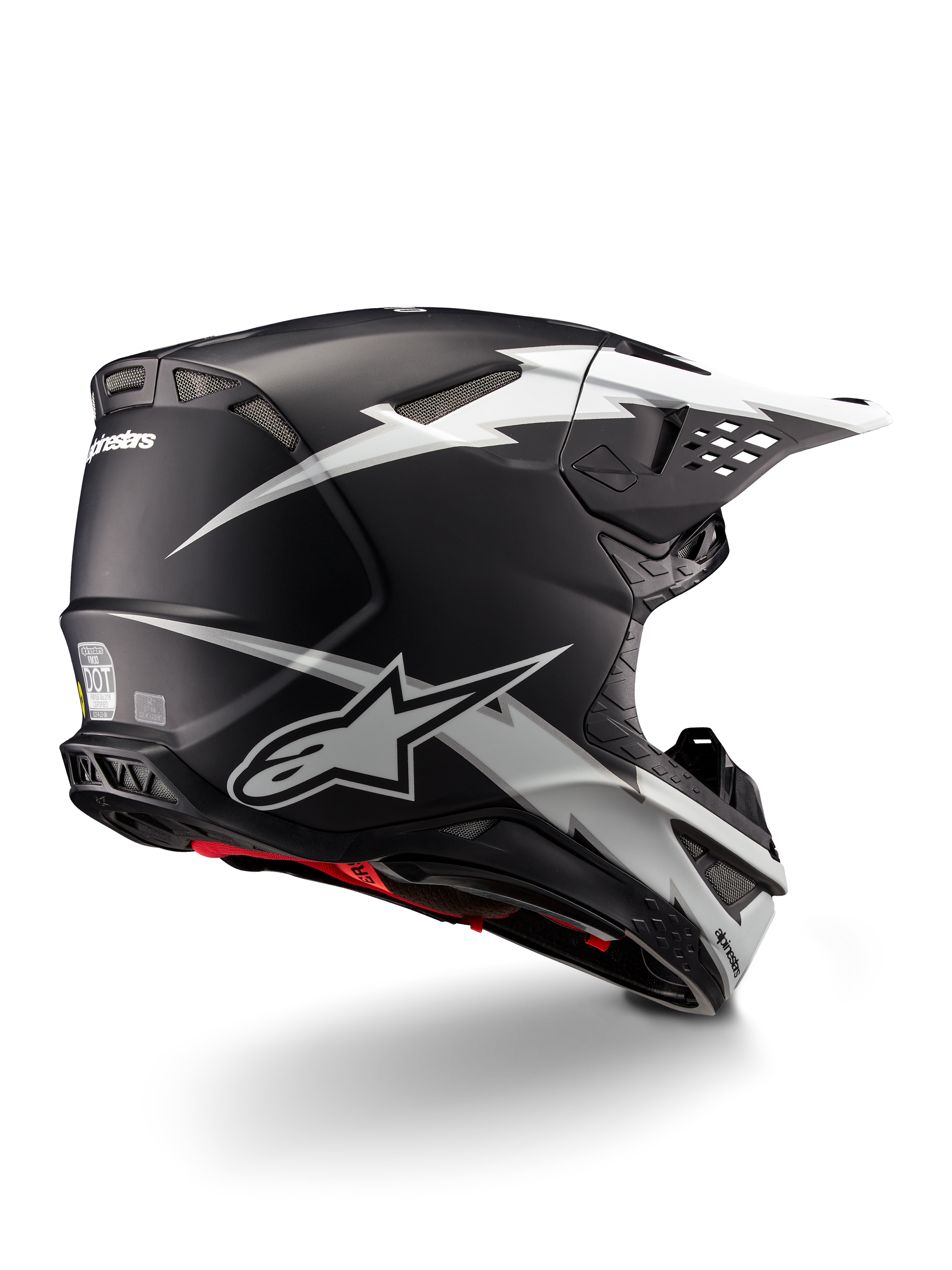Alpinestars Supertech M10 Ampress hjelm, motocrosshjelm, sort og hvid mat, med markante hvide lyngrafikker på en matsort skal, set trekvart bagfra, der viser Alpinestars-branding og ventilationsåbninger