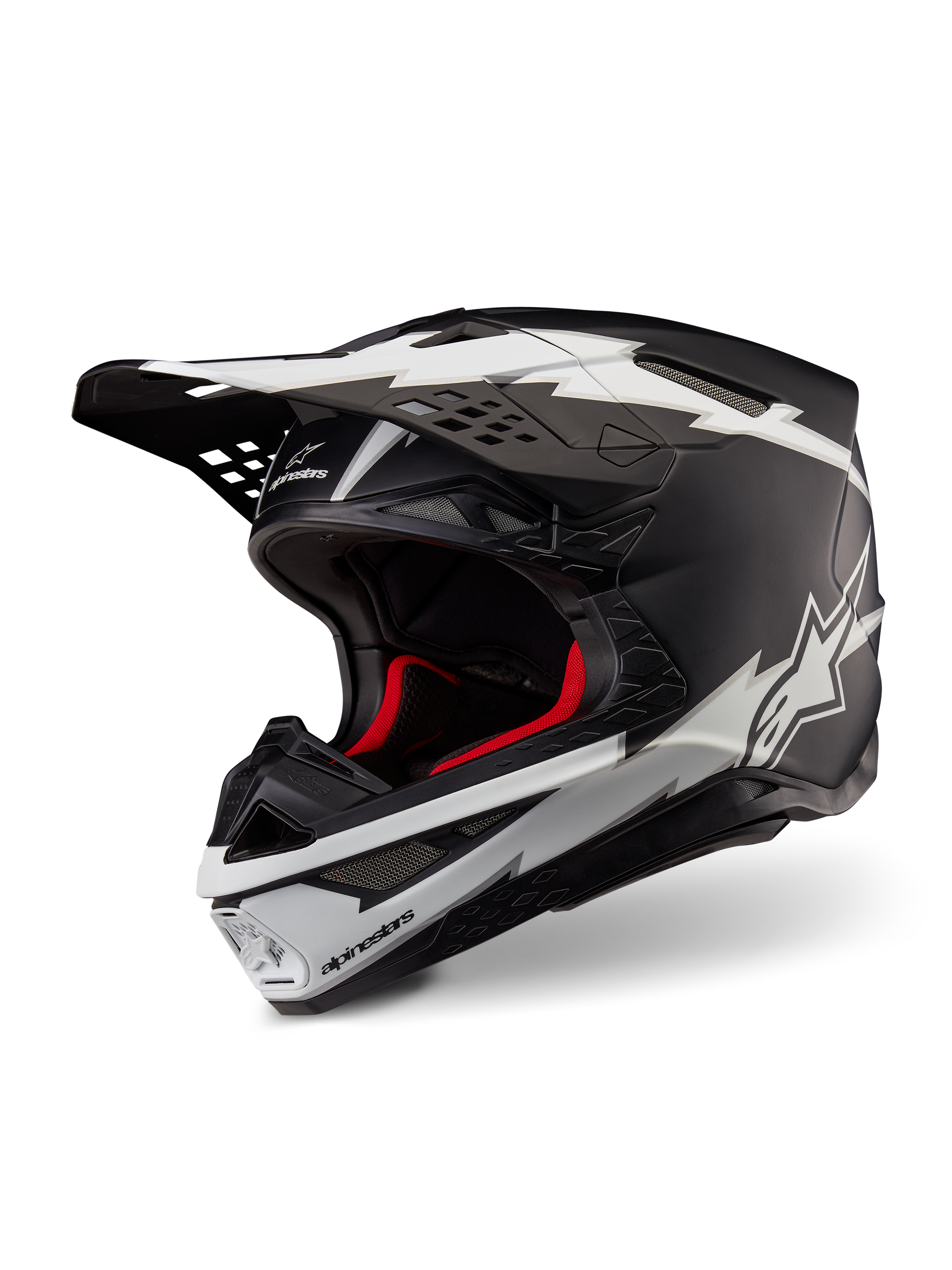 Alpinestars Supertech M10 Ampress hjelm, motocross-hjelm, mat sort og hvid, med markante hvide lyn-grafikker og stjerne-logoer, rødt indvendigt for, multi-komposit carbon-skal med en strømlinet aerodynamisk profil