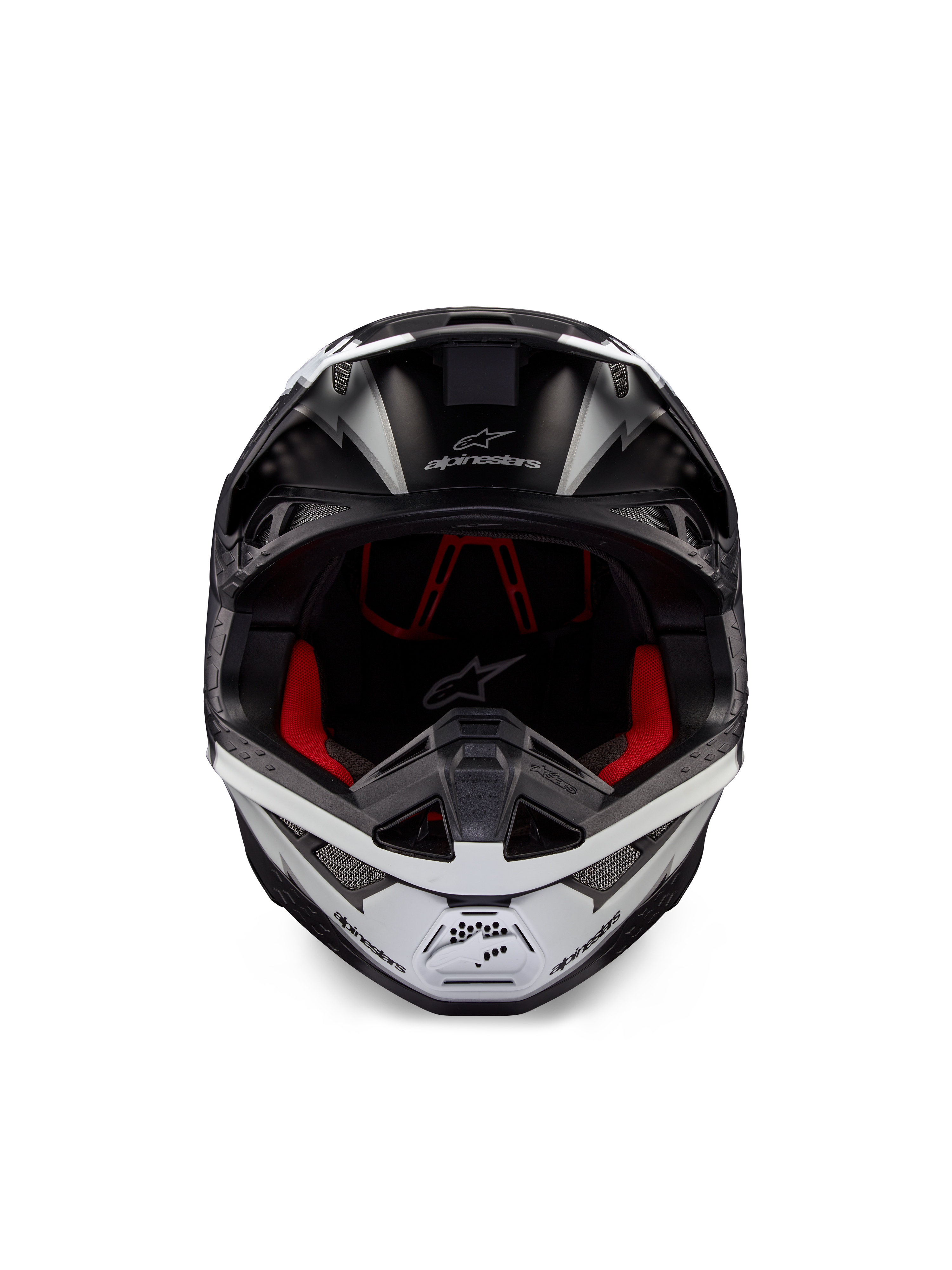 Alpinestars Supertech M10 Ampress hjelm, motocross-hjelm, sort og hvid mat, set forfra med rødt indvendigt for, aerodynamisk skal med ventilationsporte og Alpinestars-logo