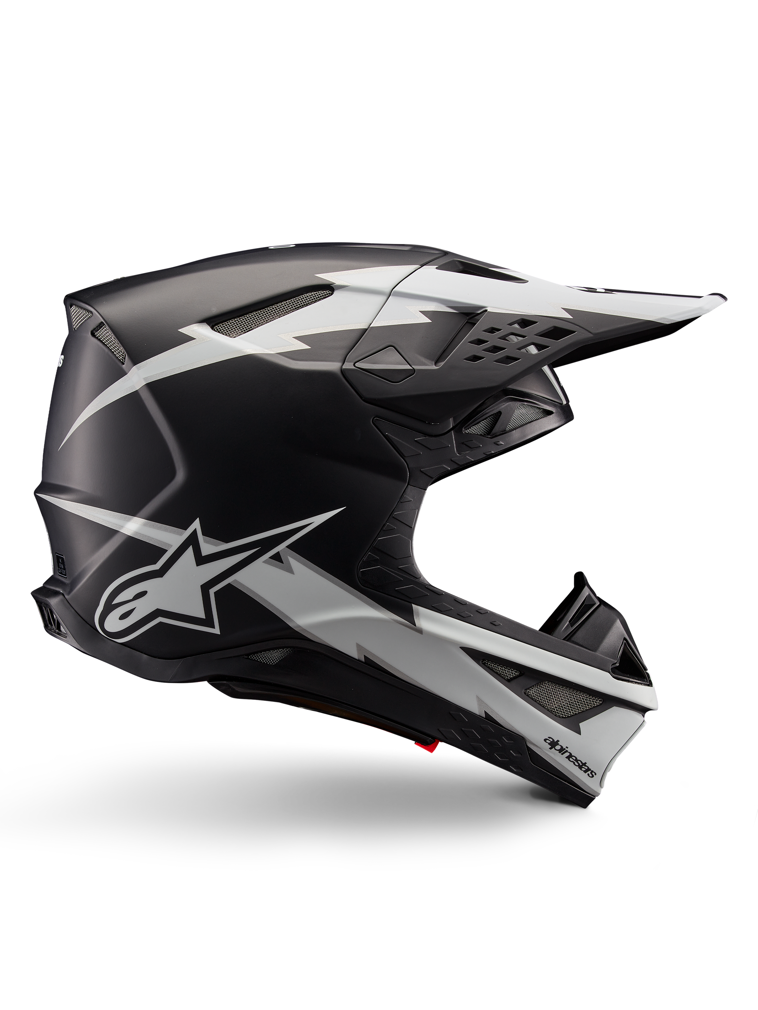 Alpinestars Supertech M10 Ampress Helmet, Motocross Racing Helmet, Black and White Matte, aerodynamic profile with white lightning bolt graphics, multiple air vents, extended sun visor, carbon fiber construction with matte finish