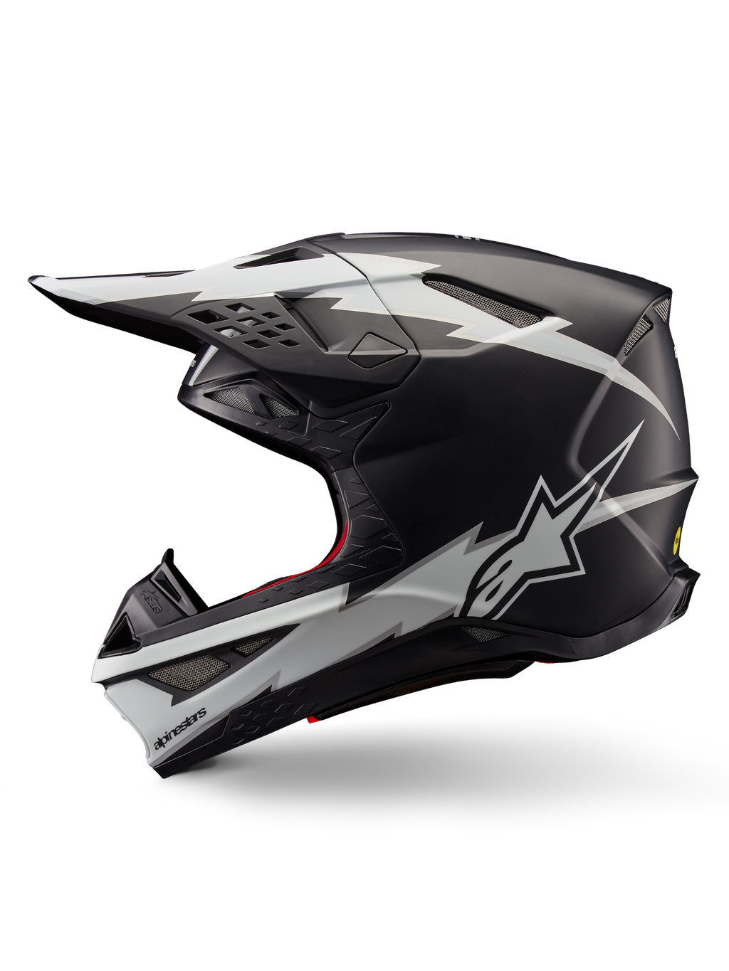 Alpinestars Supertech M10 Ampress hjelm, motocross-hjelm, matsort og hvid, profilvisning med markant hvid lyn-grafik, aerodynamisk skal med synlige ventilationsåbninger og visir, avanceret off-road beskyttelse