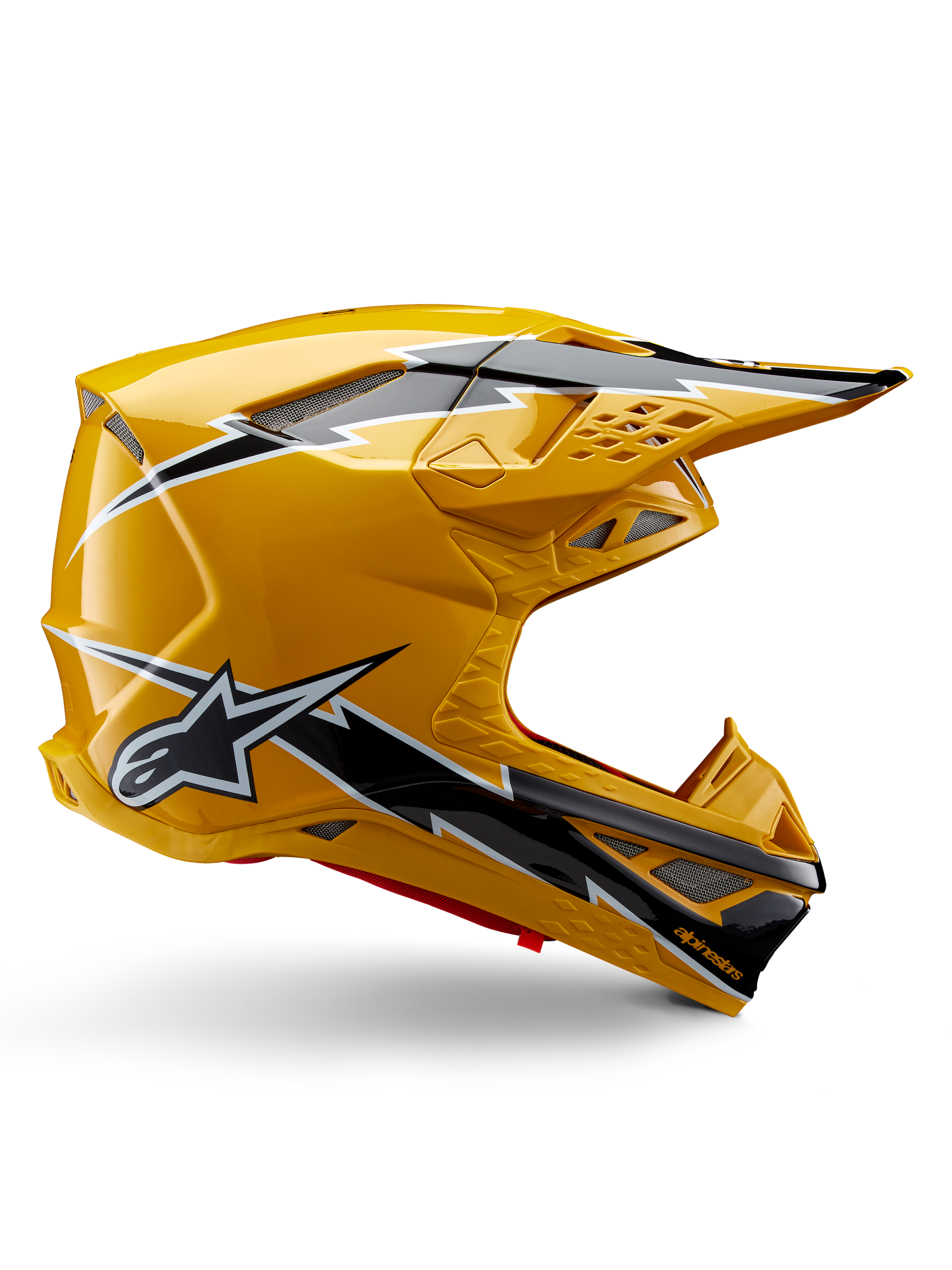 Alpinestars Supertech M10 Ampress hjelm, motocrosshjelm, sort og gul blank, sideprofil der viser markant sort og hvid lyn-grafik, Alpinestars stjerne-logo, aerodynamisk design med integrerede ventilationsporte og justerbart visir.