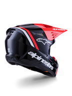 Alpinestars S-M3 Radium hjelm, motocross-hjelm, blank sort, neonrød og hvid, trekvartvisning bagfra der viser strømlinet aerodynamisk design, hvidt logo og klar rød skygge, højtydende beskyttelsesudstyr til terrænkørsel