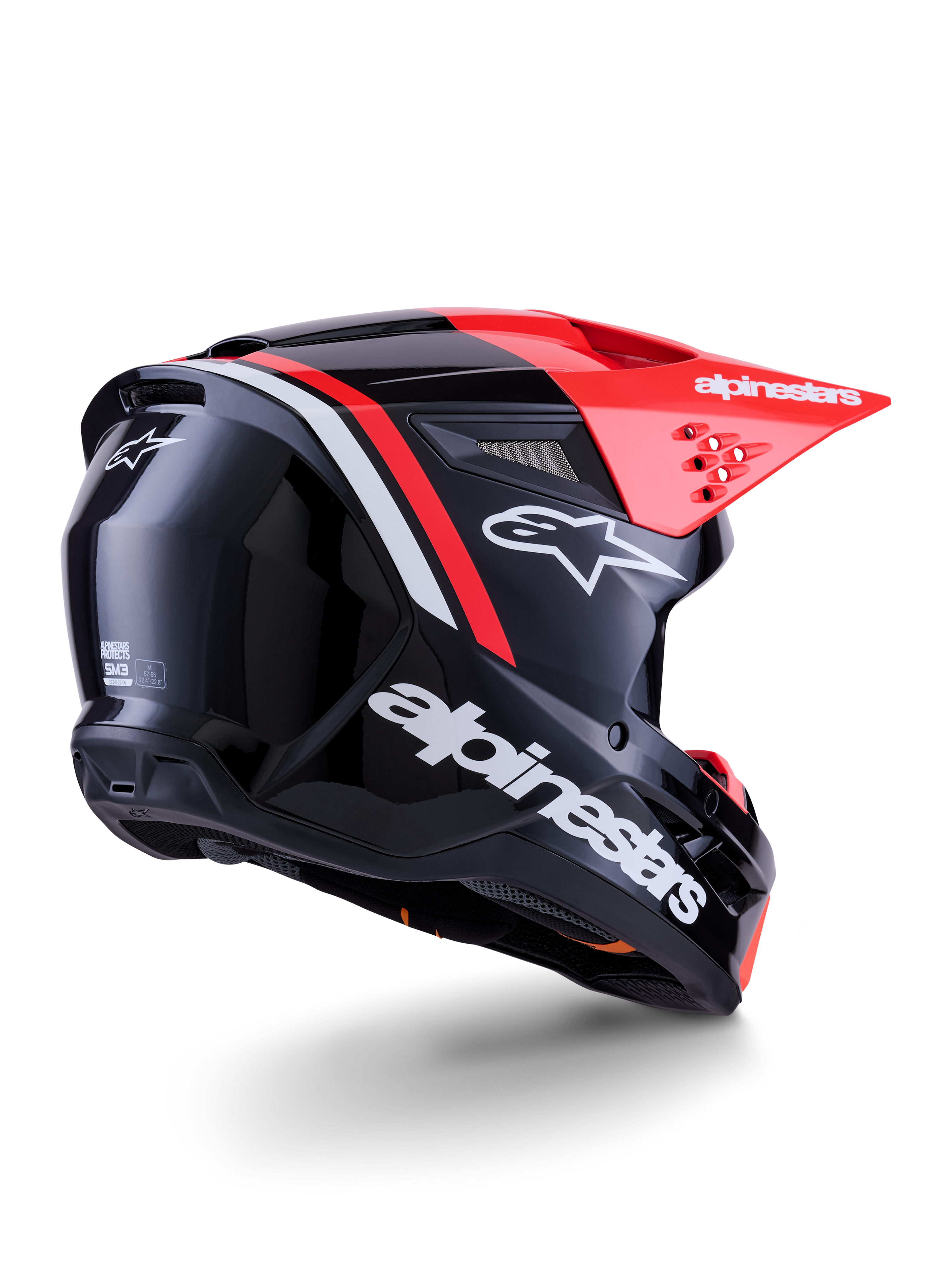 Alpinestars S-M3 Radium hjelm, motocross-hjelm, blank sort, neonrød og hvid, trekvartvisning bagfra der viser strømlinet aerodynamisk design, hvidt logo og klar rød skygge, højtydende beskyttelsesudstyr til terrænkørsel
