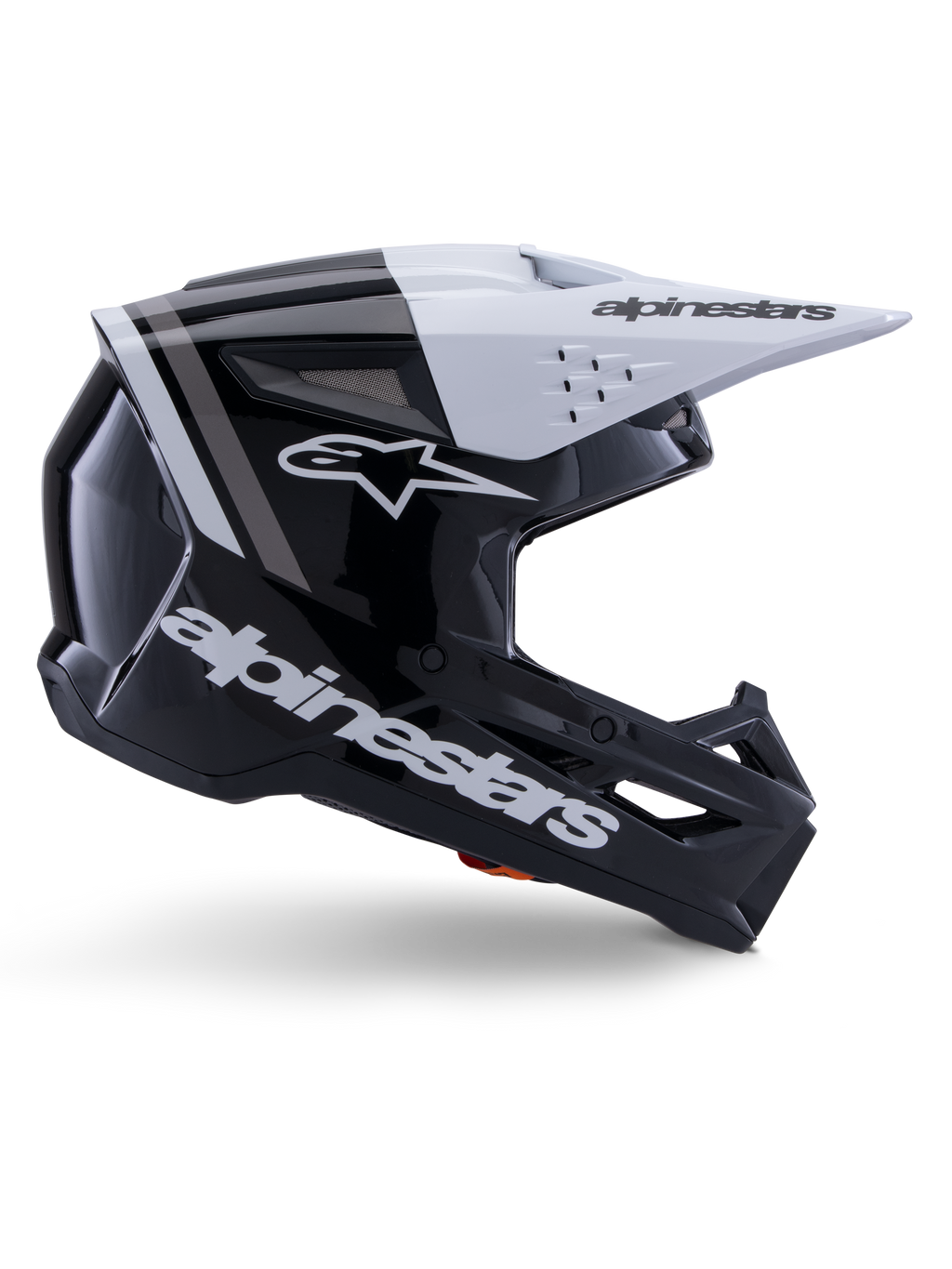 Alpinestars S-M3 Radium hjelm, motocross off-road hjelm, sort, hvid og grå blank, med et kantet aerodynamisk design og ventilationsåbninger, set fra siden, blank finish med grå striber og et hvidt visir med Alpinestars-branding