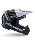 Alpinestars S-M3 Radium hjelm, motocross off-road hjelm, sort, hvid og grå blank, med et kantet aerodynamisk design og ventilationsåbninger, set fra siden, blank finish med grå striber og et hvidt visir med Alpinestars-branding