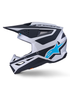 Alpinestars S-M3 Heat Helmet ECE 22.06, Motocross Helmet, Silver Blue and Black Matte finish, side profile view, featuring a bright blue Alpinestars star logo, black visor, and multiple ventilation ports, aggressive aerodynamic design for off-road racing