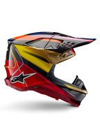 Alpinestars Supertech M10 Era Helmet, Motocross Racing Helmet, Gold Yellow and Rio Red Glossy with Blue and Black accents, aerodynamic design with integrated visor, multiple mesh-covered ventilation ports, and carbon fiber details, ECE 22.06 certified