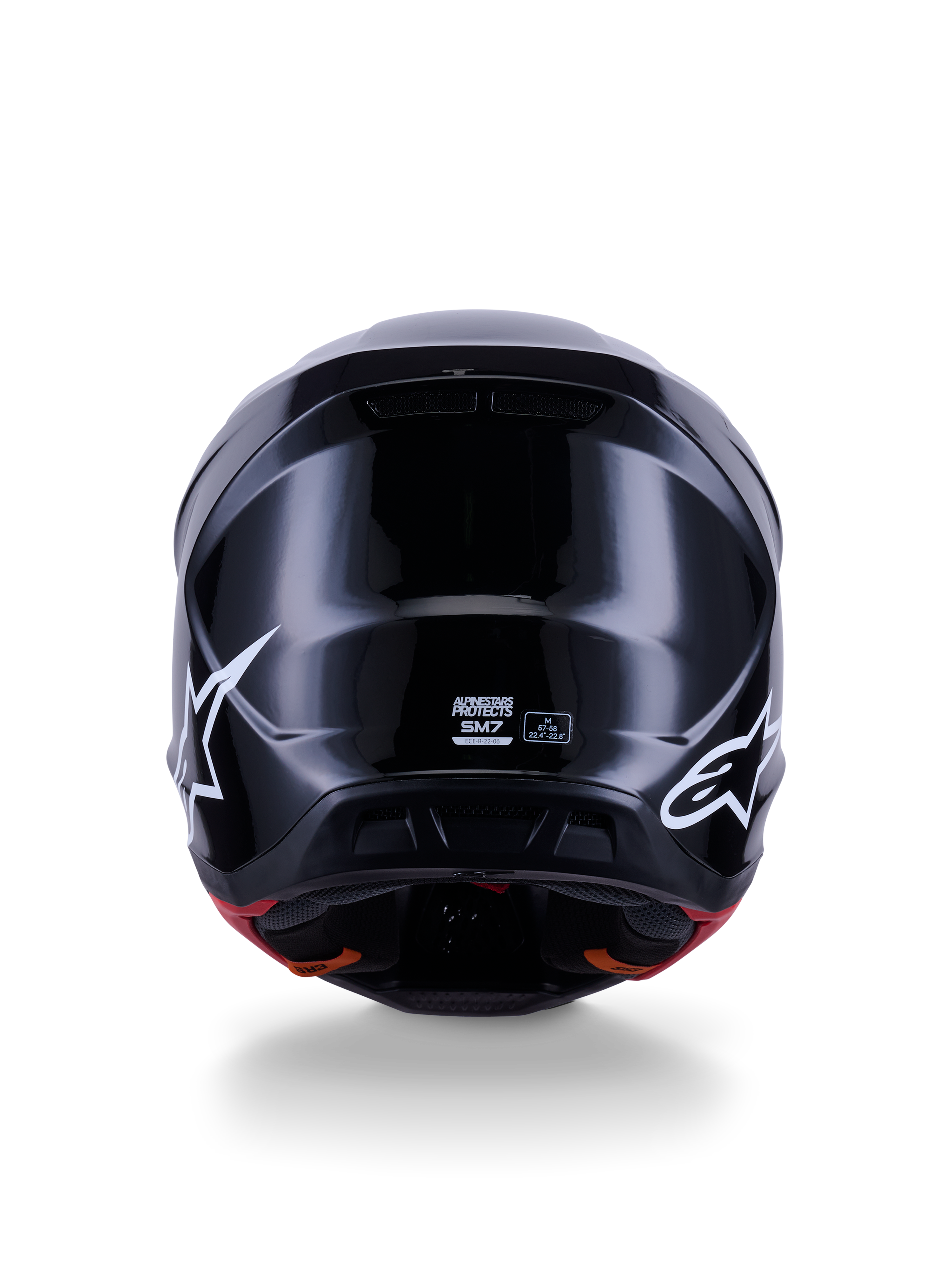 Alpinestars S-M7 Solid hjelm ECE 22.06, motocrosshjelm, blank sort, set bagfra med hvide stjernelogoer, aerodynamisk kompositskal med en højglansfinish, sikkerhedscertificering og størrelseslabels i midten