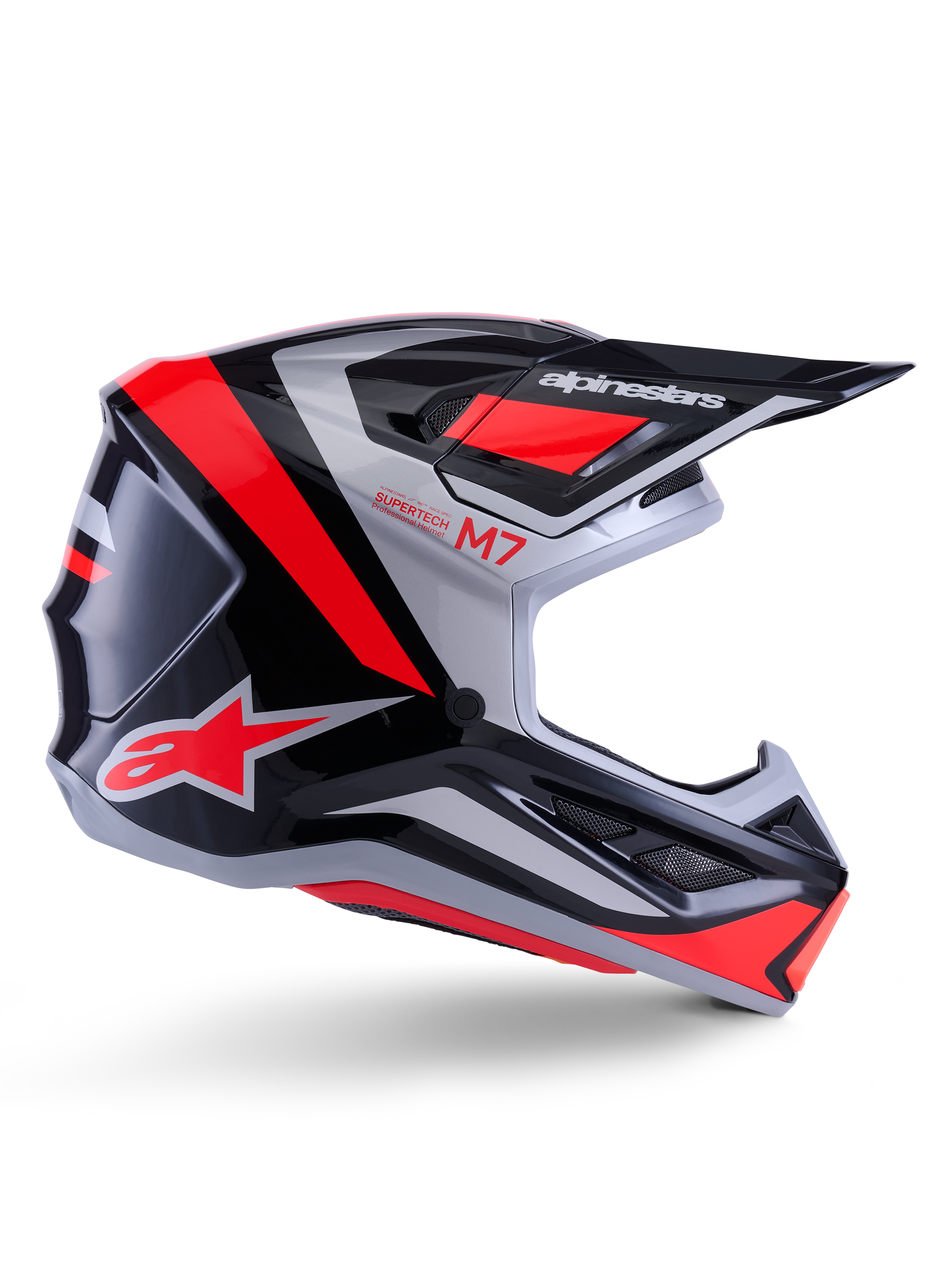 Alpinestars S-M7 Rise hjelm, motocrosshjelm, sort, sølv og rød fluo, set fra siden med vinklet aerodynamisk design, skygge og ventilationsåbninger, blank finish, Supertech M7-serien
