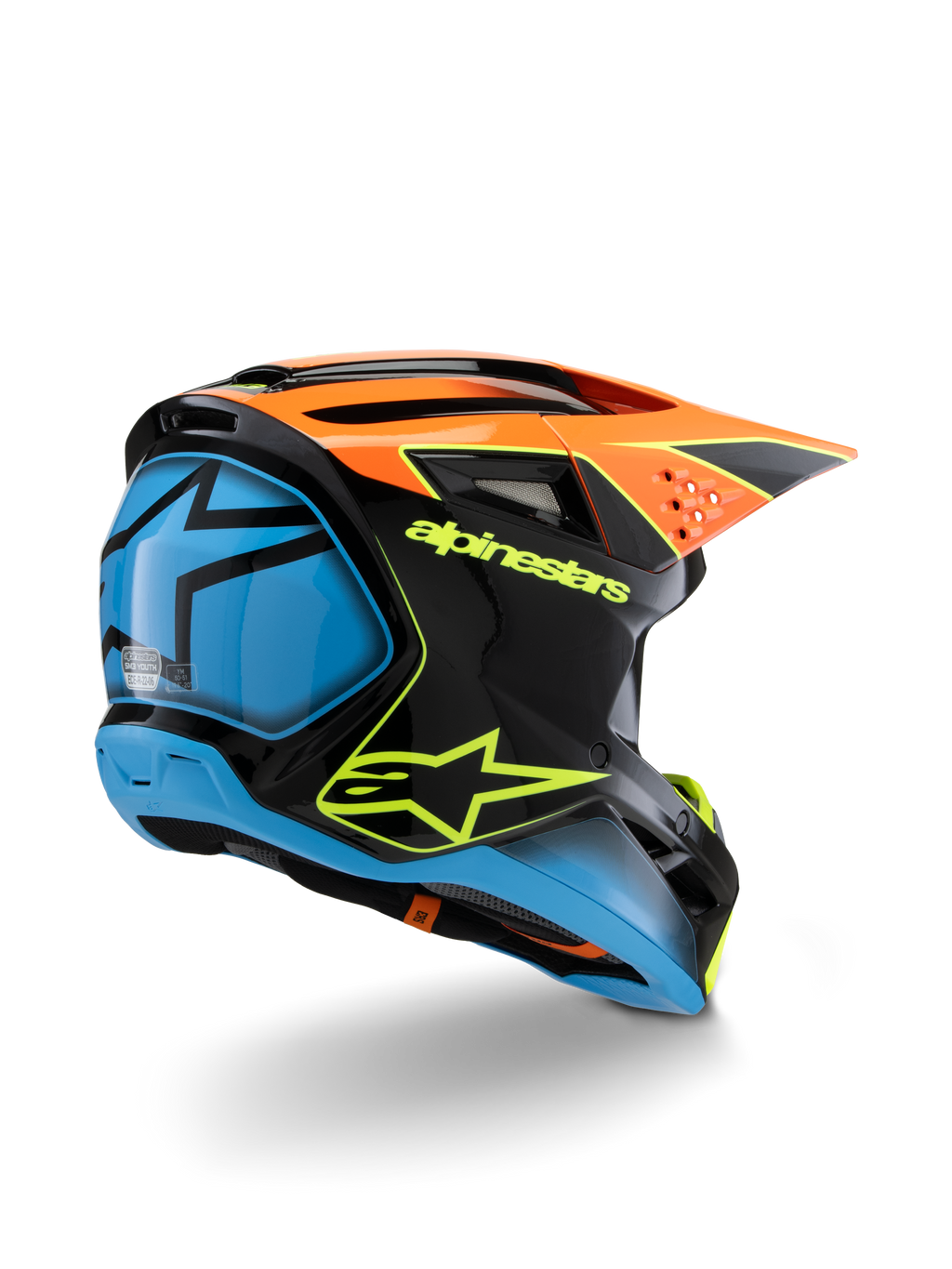 Alpinestars S-M3 Youth Fray hjelm, motocrosshjelm, sort, orange og blå med neongule detaljer, set skråt bagfra med tydeligt Alpinestars-branding og stjernelogo, strømlinet aerodynamisk design til off-road kørsel for unge