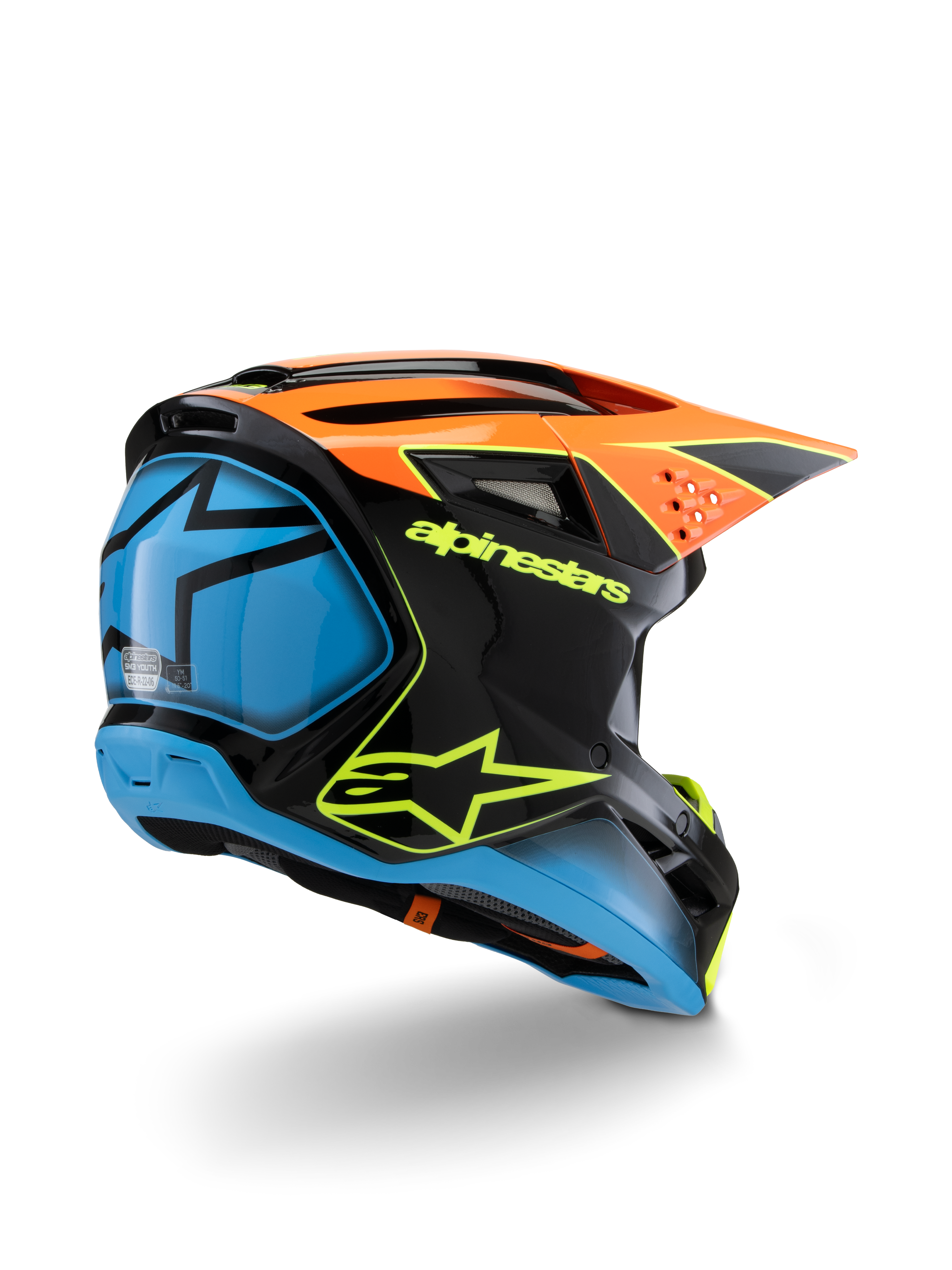 Alpinestars S-M3 Youth Fray hjelm, motocrosshjelm, sort, orange og blå med neongule detaljer, set skråt bagfra med tydeligt Alpinestars-branding og stjernelogo, strømlinet aerodynamisk design til off-road kørsel for unge
