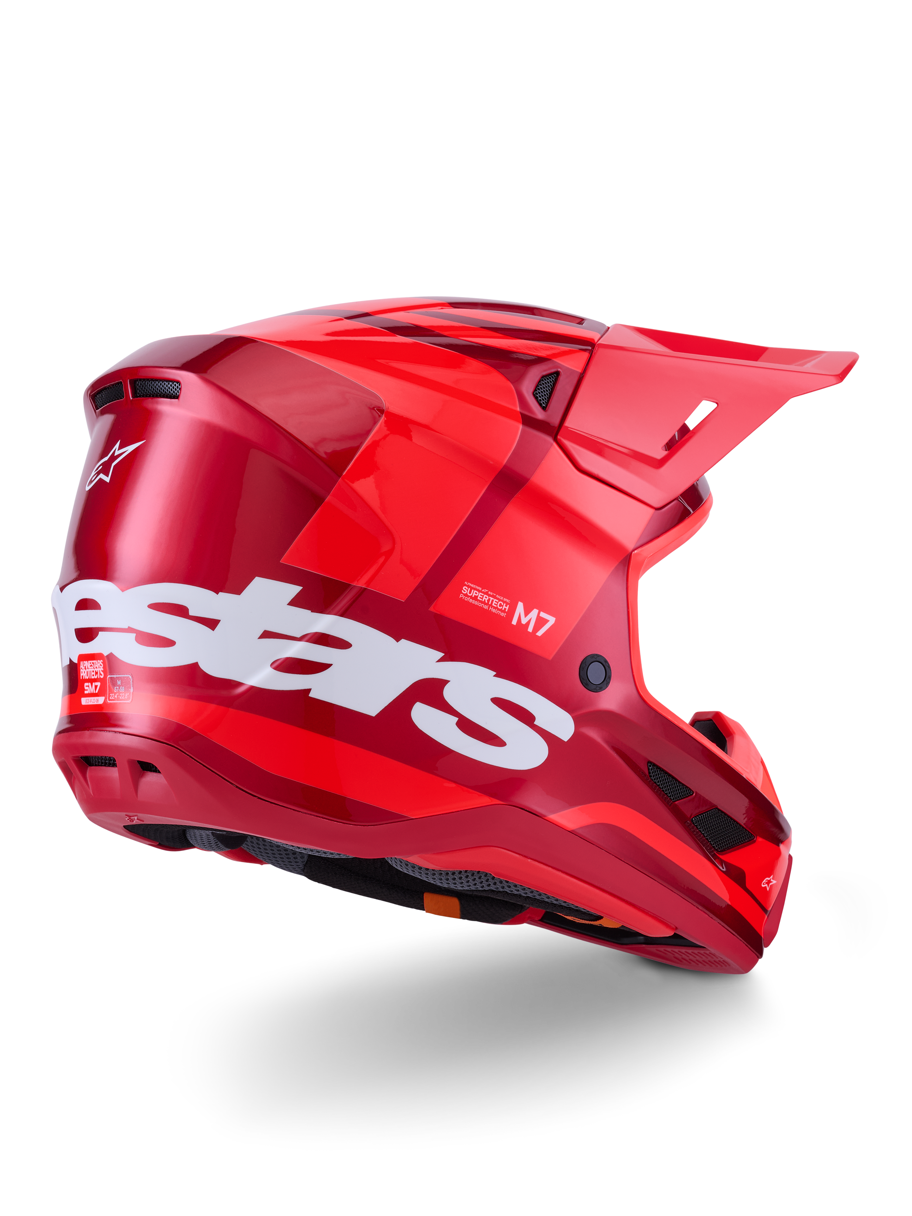 Alpinestars S-M7 Core hjelm, motocrosshjelm, blank rød med stort hvidt Alpinestars-logo på siden, med aerodynamisk skal, integrerede ventilationsporte og beskyttende visir, 3/4 visning bagfra