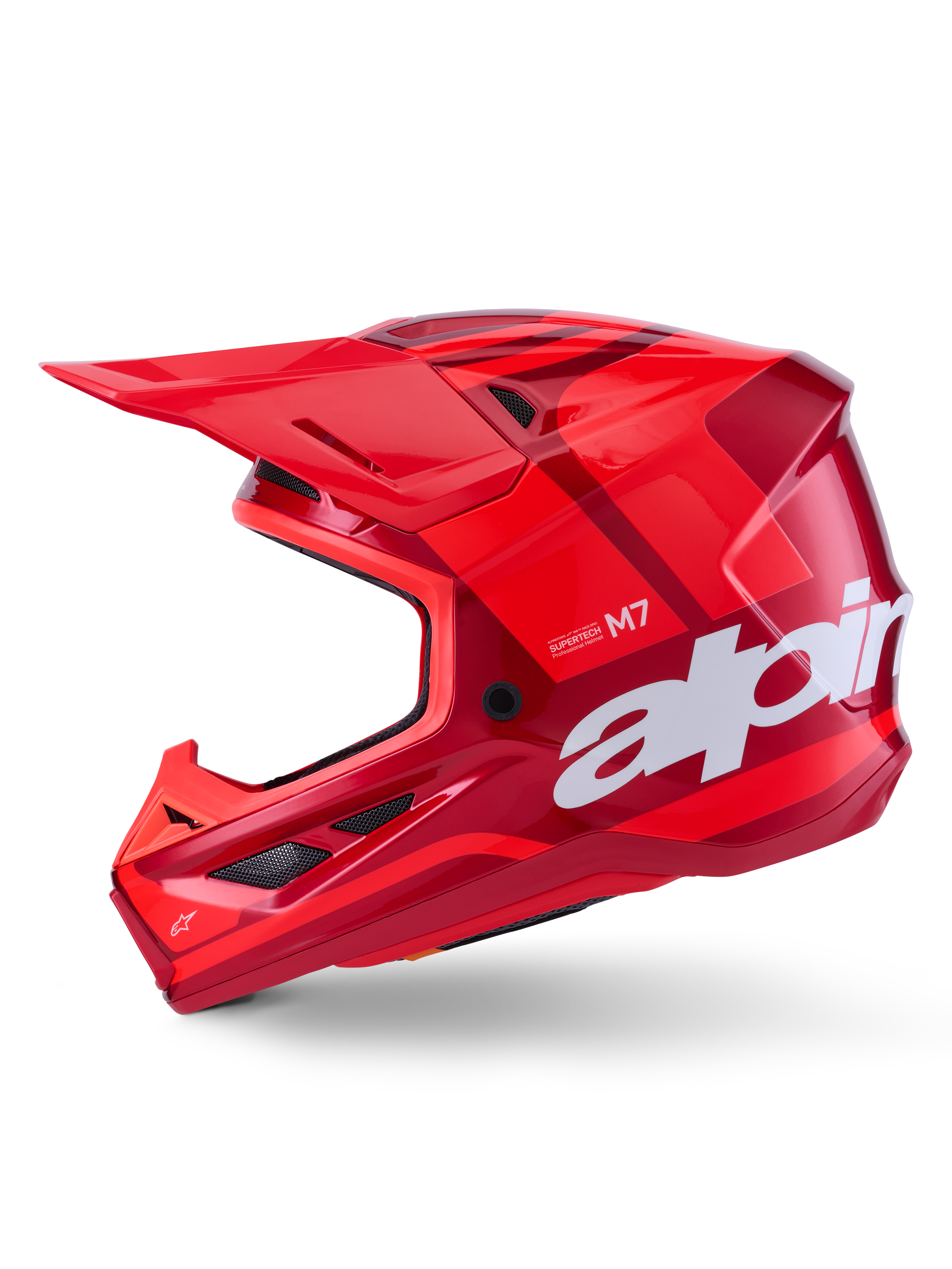 Alpinestars S-M7 Core hjelm, blank rød med geometriske accenter, motocross-hjelm, sideprofil, aerodynamisk skal med ventilationsporte og hvid branding, højtydende off-road racingudstyr