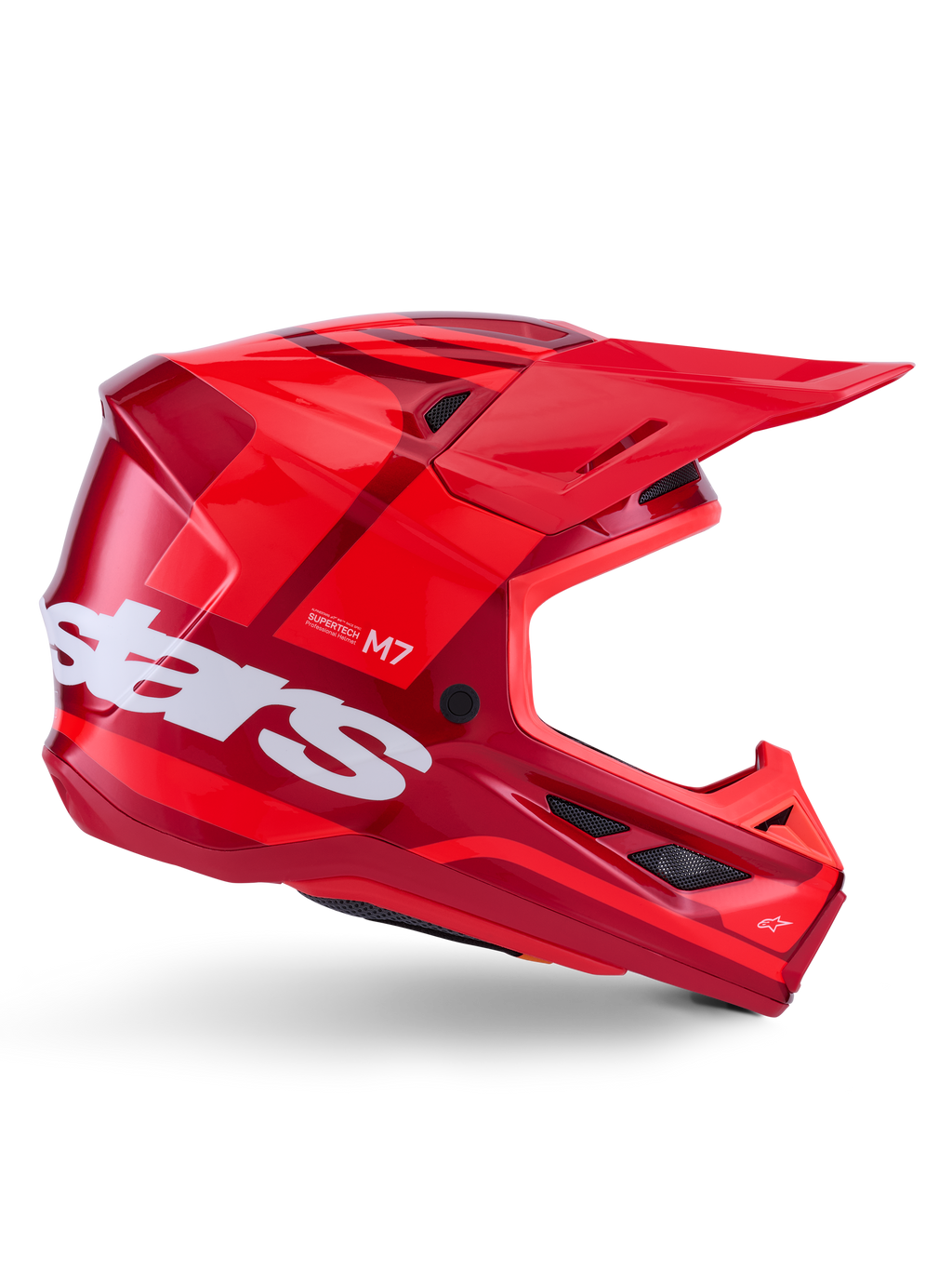 Alpinestars S-M7 Core hjelm, motocrosshjelm, blank rød med mørkerøde detaljer og hvid branding, set fra siden med et stort hvidt stars-logo, aerodynamisk skal med ventilationsåbninger og et fremtrædende visir