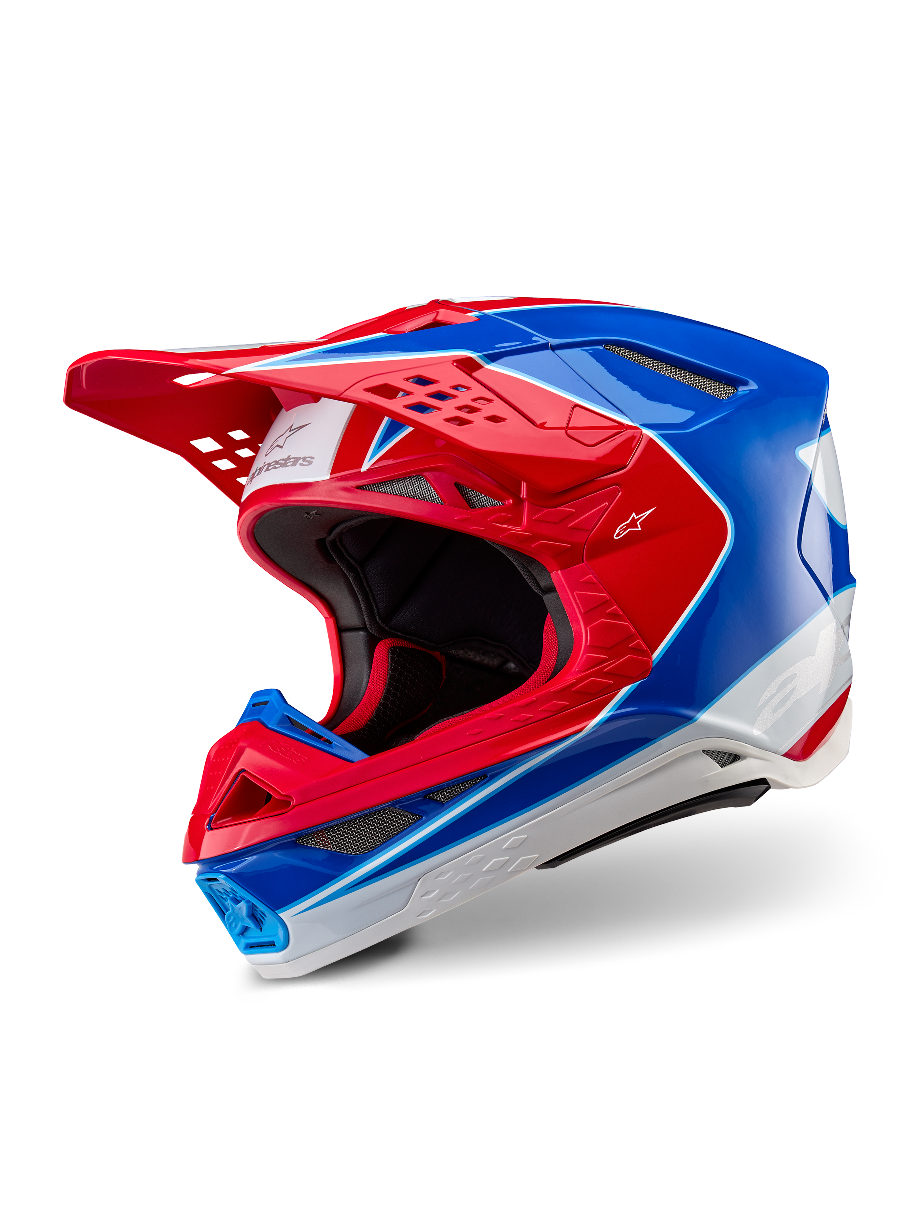 Alpinestars Supertech M10 Aeon hjelm, motocrosshjelm, klar rød og blå i blank finish, trekvart visning der viser den aerodynamiske skal med flere ventilationsporte, hvide og røde grafiske accenter, Alpinestars-logo på visiret og siden, professionelt off-road racerudstyr