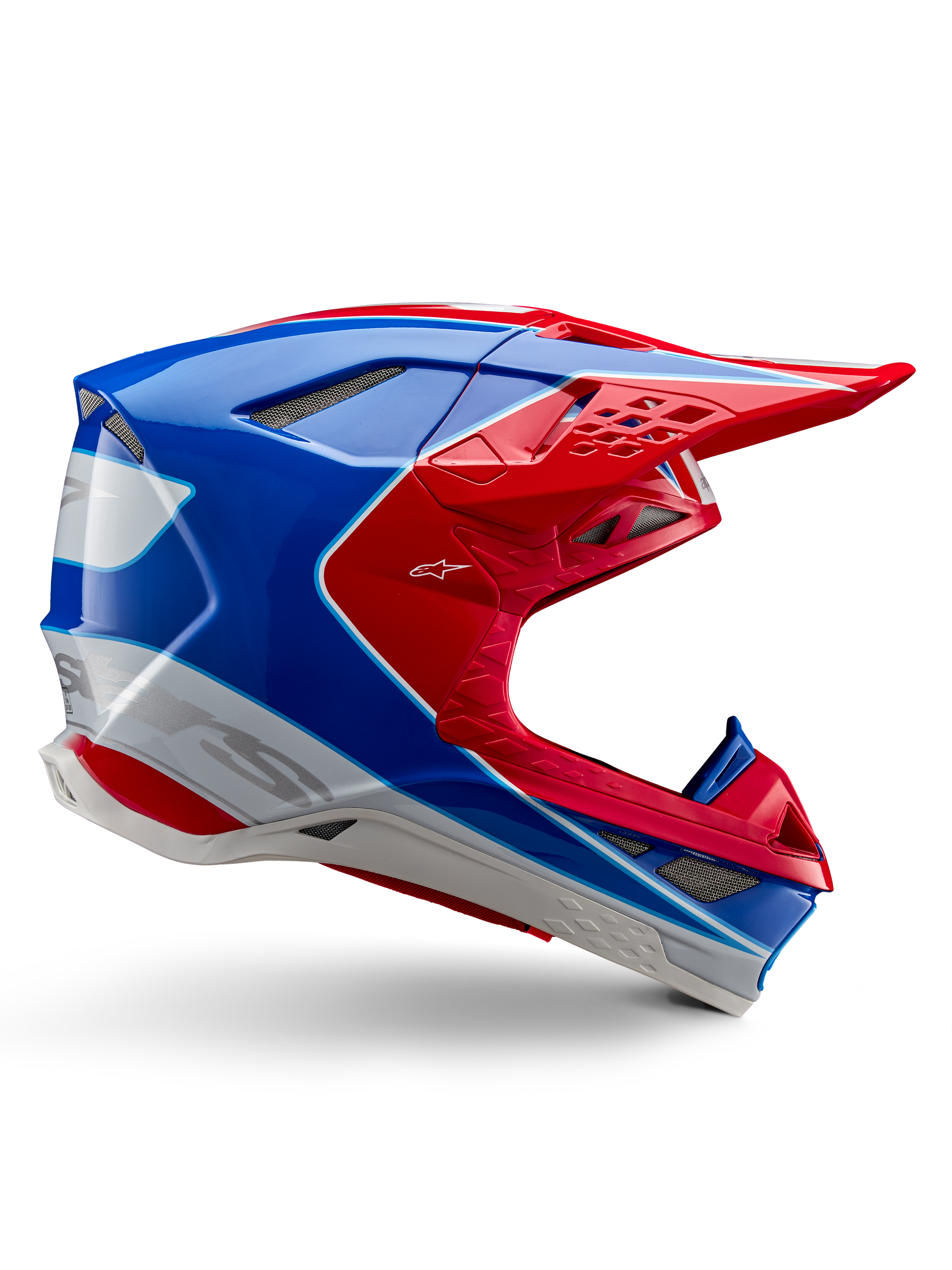 Alpinestars Supertech M10 Aeon Helmet, Motocross Racing Helmet, Bright Red, Blue and White, glossy finish, aerodynamic side profile with multiple mesh-covered air vents, angular contours and peak visor