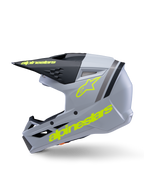 Alpinestars S-M3 Youth Radium hjelm ECE 22.06, motocrosshjelm, grå, sort og gul fluo mat, set fra siden med fluoriserende gule Alpinestars-logoer og sort visir, strømlinet beskyttelsesudstyr til unge kørere
