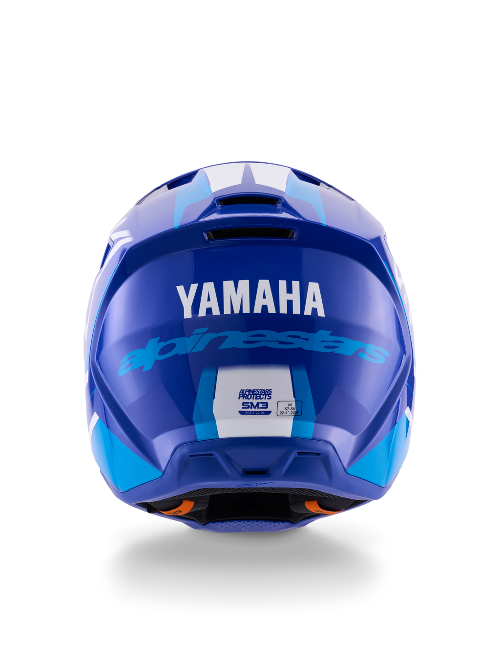 Alpinestars Yamaha S-M3 hjelm, motocrosshjelm, blå hvid blank, set bagfra med hvidt YAMAHA-logo og blå Alpinestars-skrift, elegant blank finish med synlige ventilationsåbninger og sikkerhedscertificeringsmærkater.