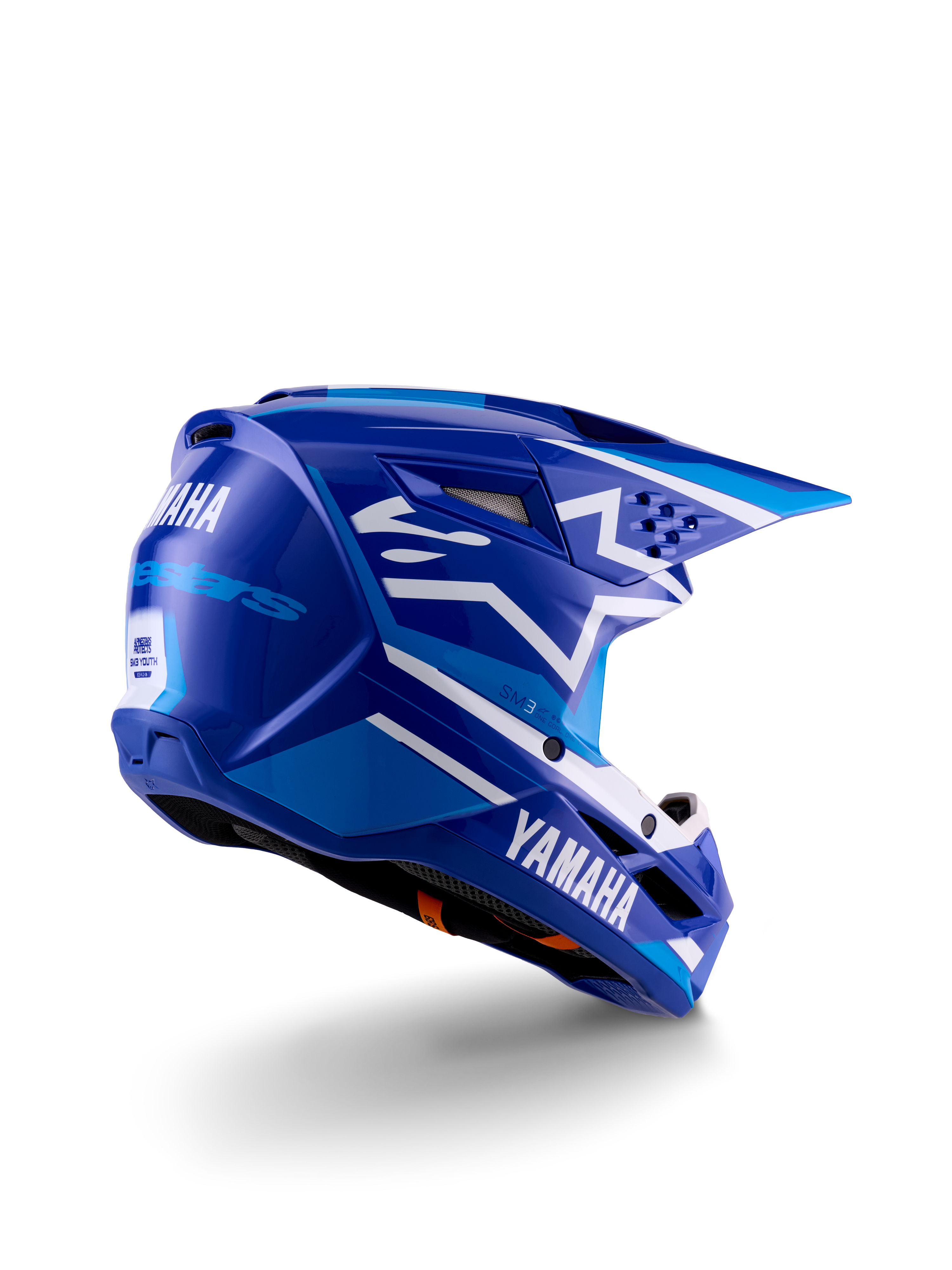 Alpinestars Yamaha S-M3 motocrosshjelm til unge, blå og hvid blank, med tydelig Yamaha-branding på siden og bagpå, aerodynamisk skaldesign med bagventilation, ungdomsspecifik hovedbeskyttelse til off-road, trekvart profil bagfra