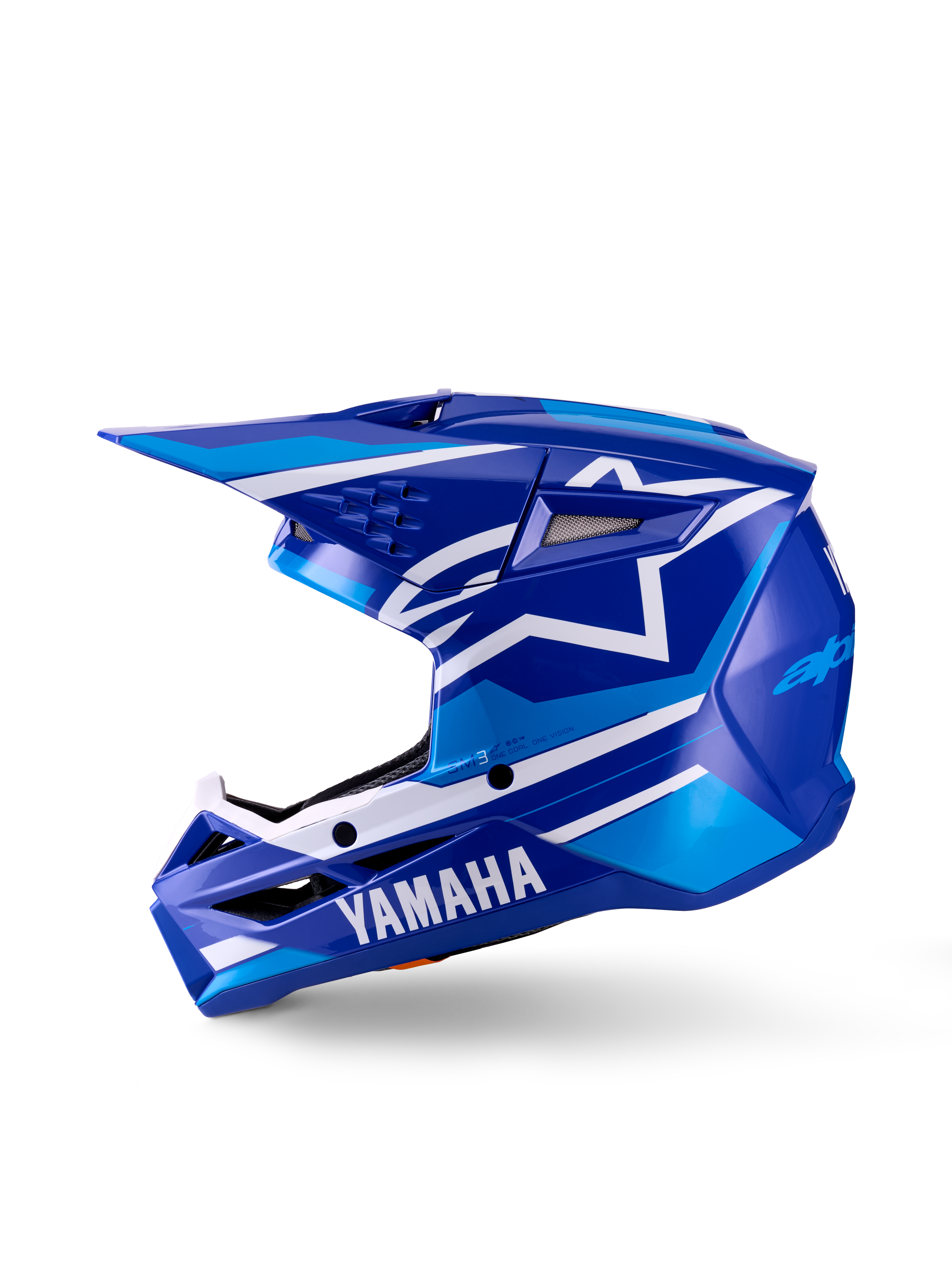 Yamaha S-M3 motocrosshjelm til unge, motocrosshjelm, blank blå og hvid, sideprofil, med tydelig Yamaha-branding på hagebeskytteren og Alpinestars stjerne-logo, strømlinet aerodynamisk skal med flere ventilationsåbninger og integreret visir.