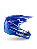 Yamaha S-M3 motocrosshjelm til unge, blå og hvid blank, sideprofil med markant Yamaha-branding og Alpinestars-stjernelogo, geometrisk design med lyseblå detaljer, ventileret skal med langt visir, ECE 22.06-certificeret off-road hovedbeskyttelse
