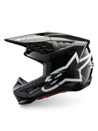 Alpinestars S-M5 Corp hjelm, mørkegrå blank motocrosshjelm med hvide brandlogoer, ECE 22.06-certificeret beskyttelse.