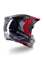 Alpinestars Honda S-M5 ECE-hjelm, motocross-hjelm, blank sort og rød, trekvartvisning bagfra med Honda-branding og Alpinestars-logoer, blank finish med røde og grå grafiske detaljer, designet til off-road-beskyttelse