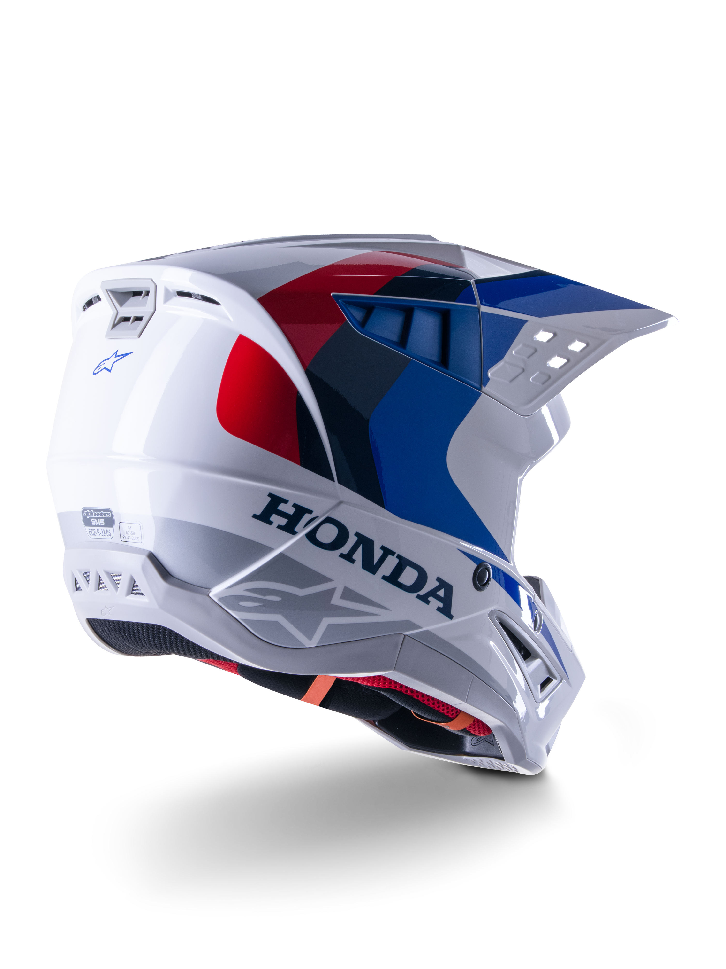 Alpinestars Honda S-M5 ECE hjelm, motocrosshjelm, hvid, blå og rød blank, med markant Honda-branding og Alpinestars-logoer, aerodynamisk skal med integrerede ventilationsåbninger og justerbart visir, beskyttelsesudstyr til terrænkørsel