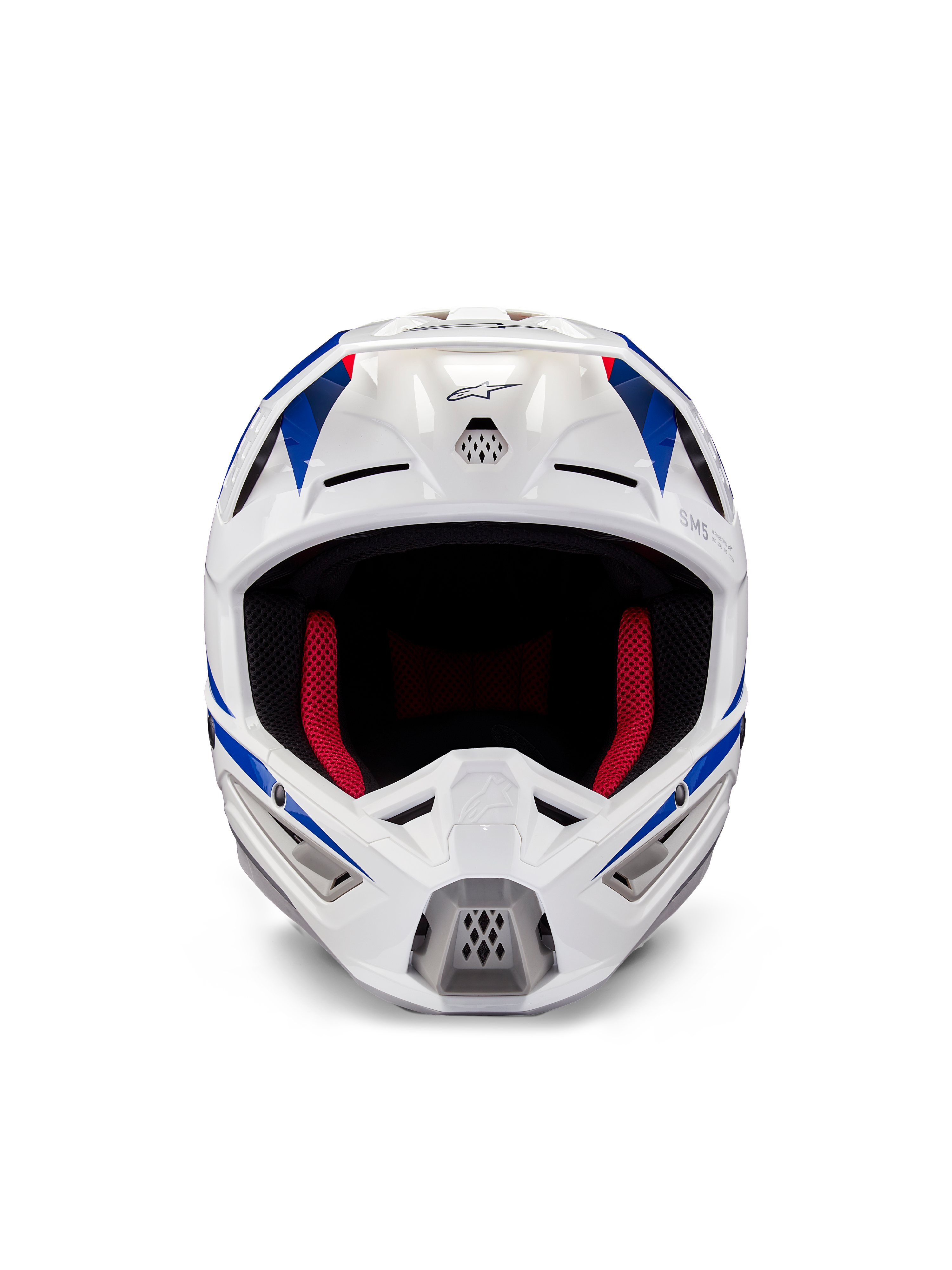 Alpinestars Honda S-M5 hjelm ECE, motocross-hjelm, hvid, blå og rød blank, set forfra med ventilationsporte og rød indvendig polstring, aerodynamisk design til beskyttelse ved terrænkørsel
