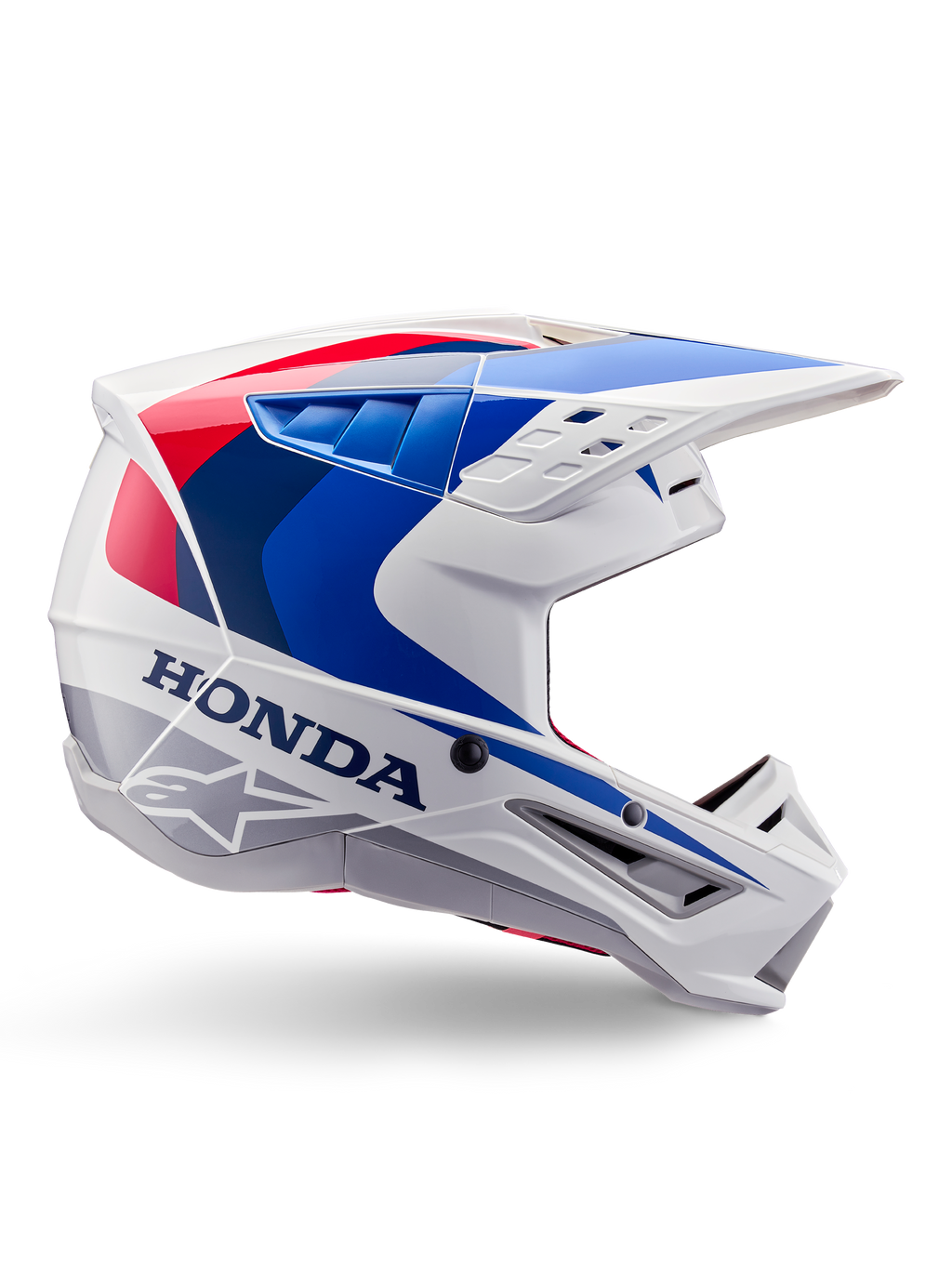 Alpinestars Honda S-M5 hjelm ECE, motocross-hjelm, hvid, blå og rød, sideprofil, aerodynamisk design med integreret visir, flere ventilationsåbninger, blank finish, tydelig Honda-branding og Alpinestars-logo