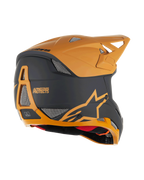 Alpinestars Missile Tech Racer hjelm, full-face MTB-hjelm, sort og mat mørk guld, set skråt bagfra med mesh-ventilationsåbninger, aerodynamisk visir og Alpinestars Protects-branding bagpå, professionel beskyttelse til downhill-cykling.