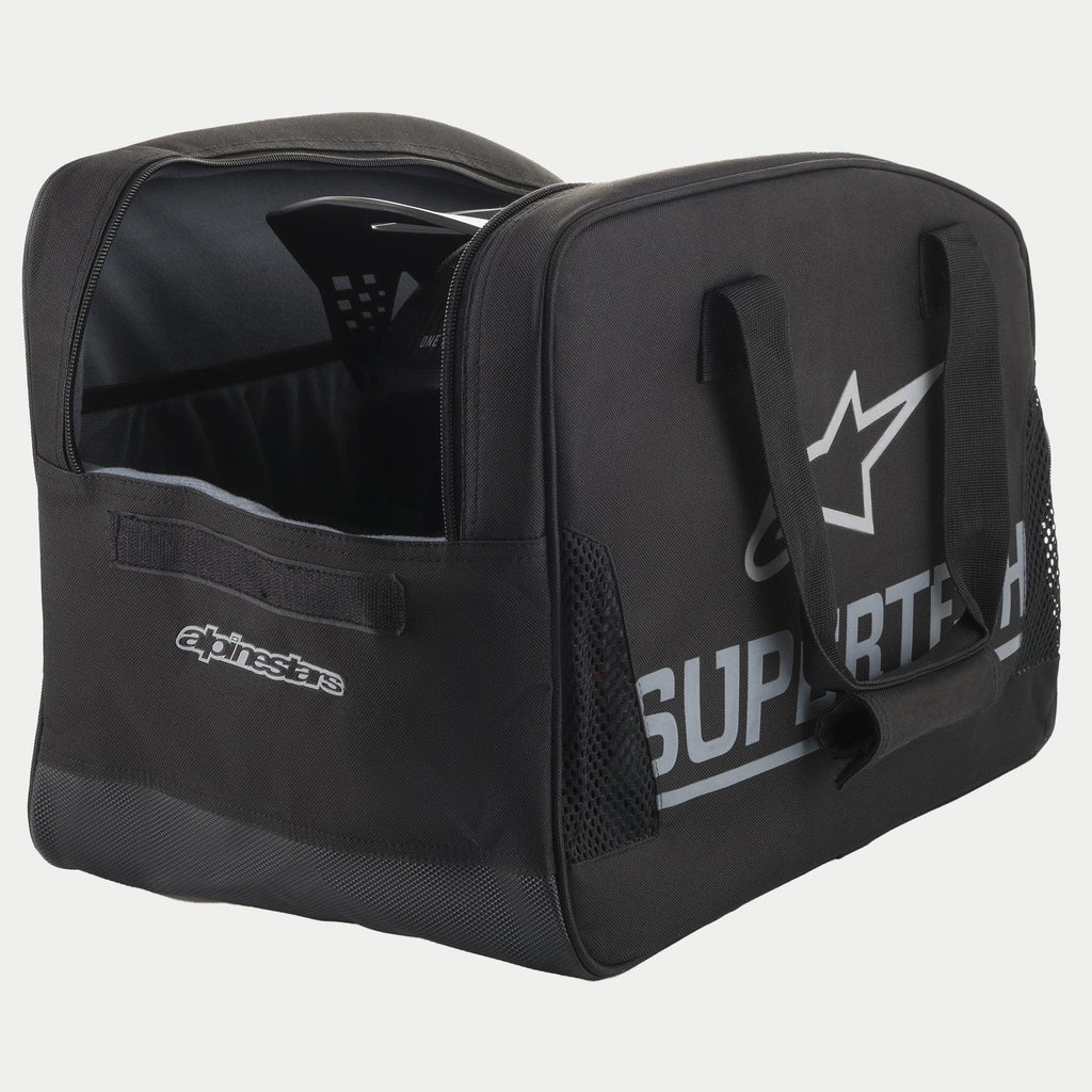 Alpinestars Supertech Semi Rigid Helmet Bag, Black motocross helmet bag featuring silver branding, durable web carrying handles, and a secure semi-rigid construction