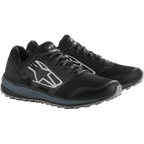Alpinestars Meta Trail Shoes, performance running shoes, Black and Dark Gray, large white striped Astars logo on the side, lace-up design with a rugged gray sole, designed for all-day comfort in the paddock